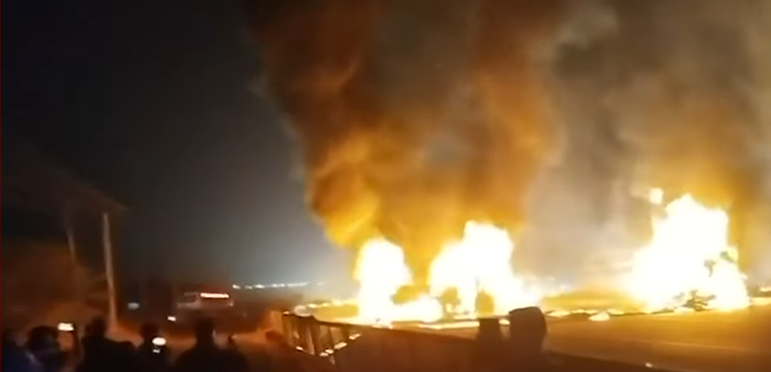 <p>Screengrab. Flames leap from a bus following a collision with a truck in Karnataka, India</p>