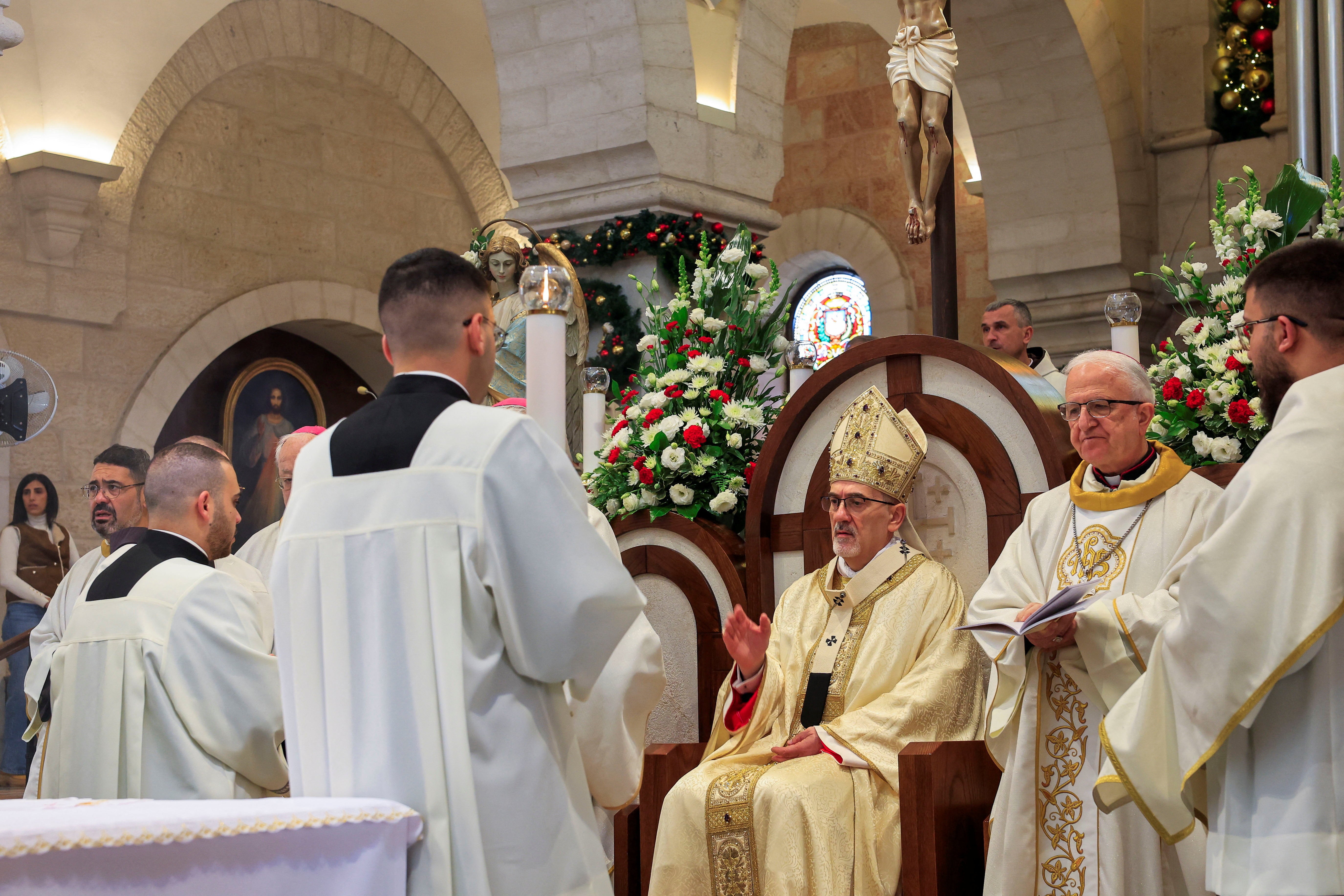 The acting Latin Patriarch of Jerusalem Pierbattista Pizzaballa attends a morning Mass at Saint Catherine's Church, in the Church of the Nativity, in Bethlehem, in the Israeli-occupied West Bank December 25, 2025. REUTERS/Mussa Qawasma