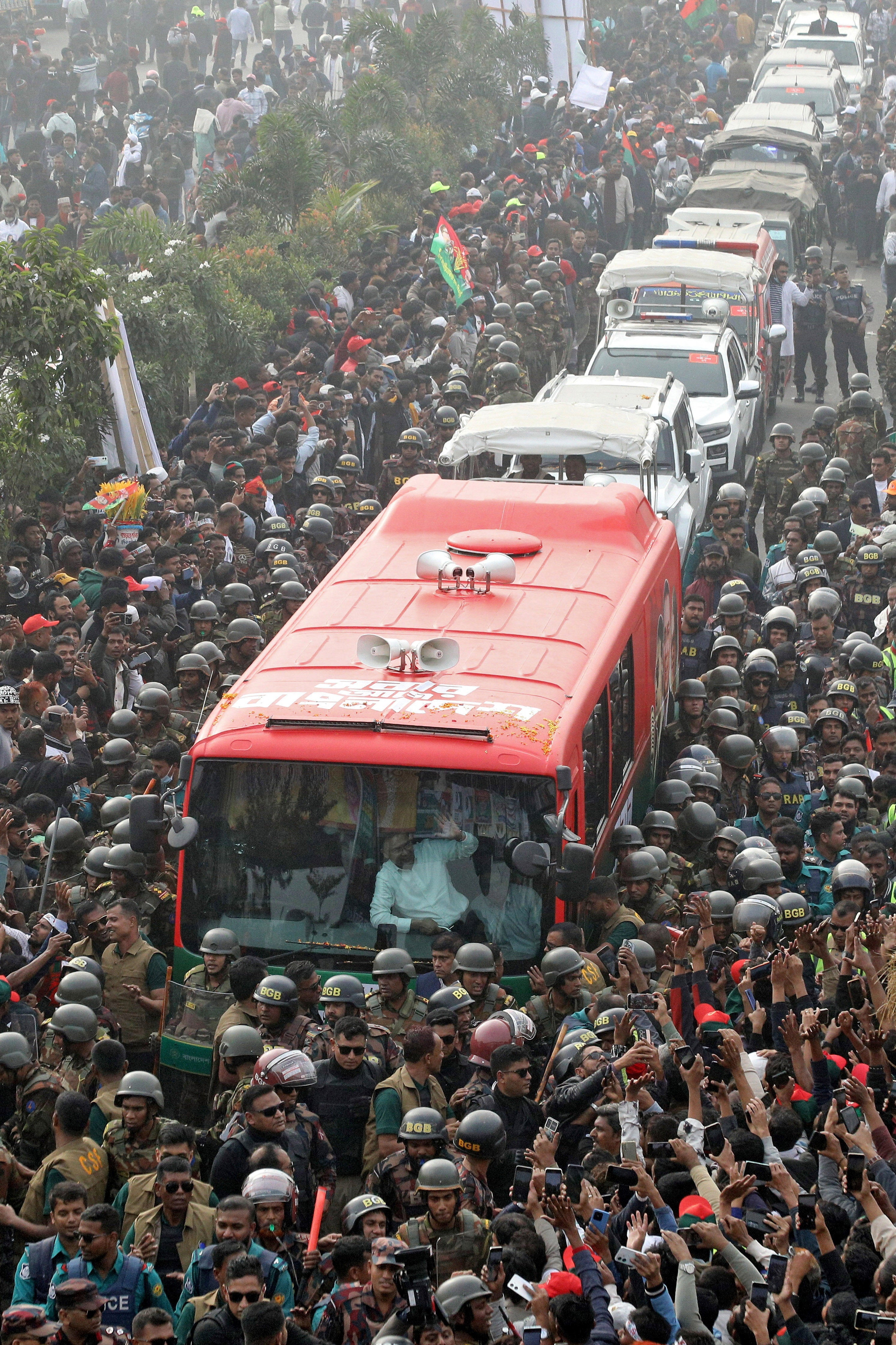 Bangladesh Nationalist Party acting chairman Tarique Rahman waves from a vehicle after his arrival from London on 25 December 2025