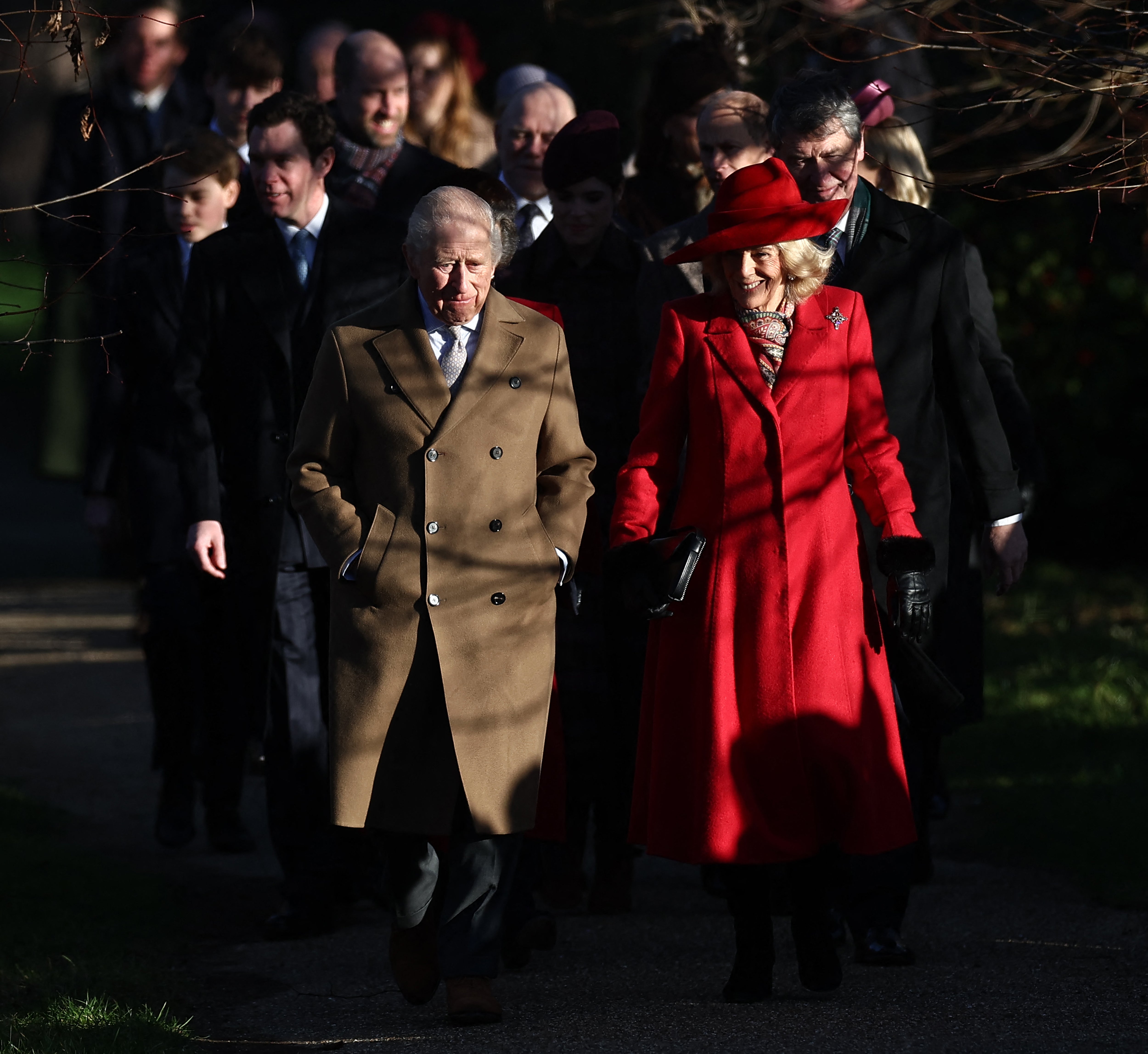 King Charles and Queen Camilla lead members of the Royal Family as they arrive for their traditional Christmas Day service