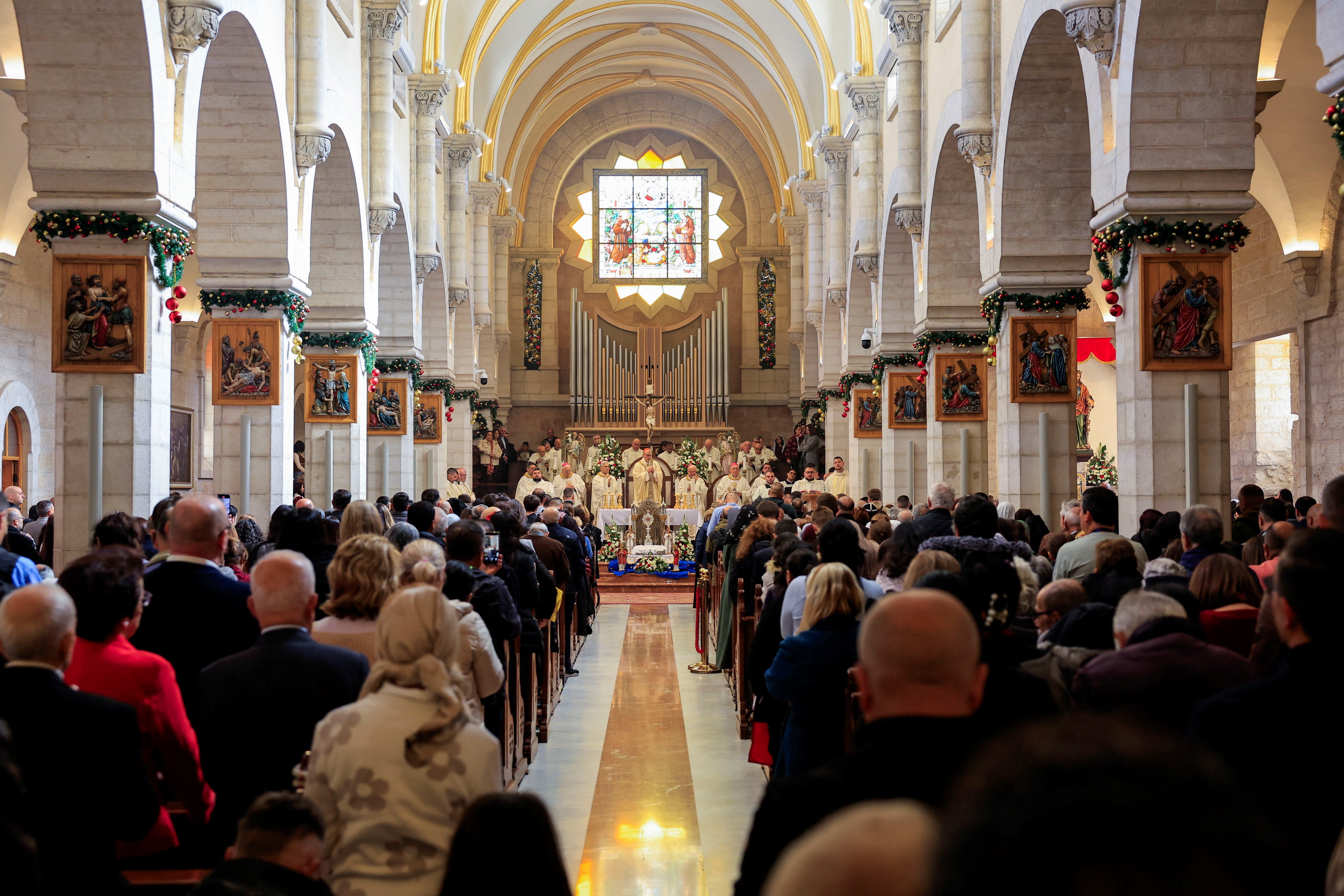 The acting Latin Patriarch of Jerusalem Pierbattista Pizzaballa attends a morning Mass at Saint Catherine's Church, in the Church of the Nativity, in Bethlehem, in the Israeli-occupied West Bank December 25, 2025. REUTERS/Mussa Qawasma