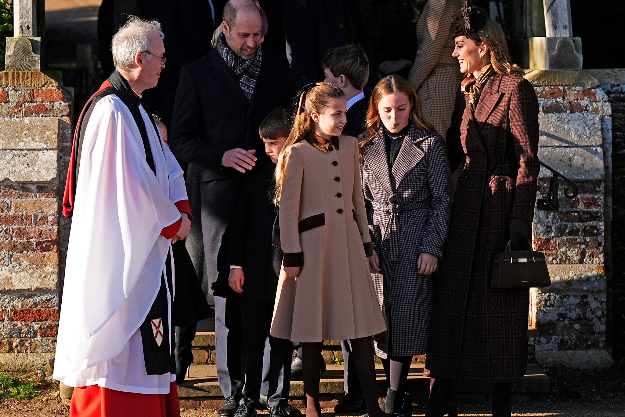 The Prince of Wales (back left) and Prince George (back right) with Prince Louis, Princess Charlotte, Mia Tindall and the Princess of Wales