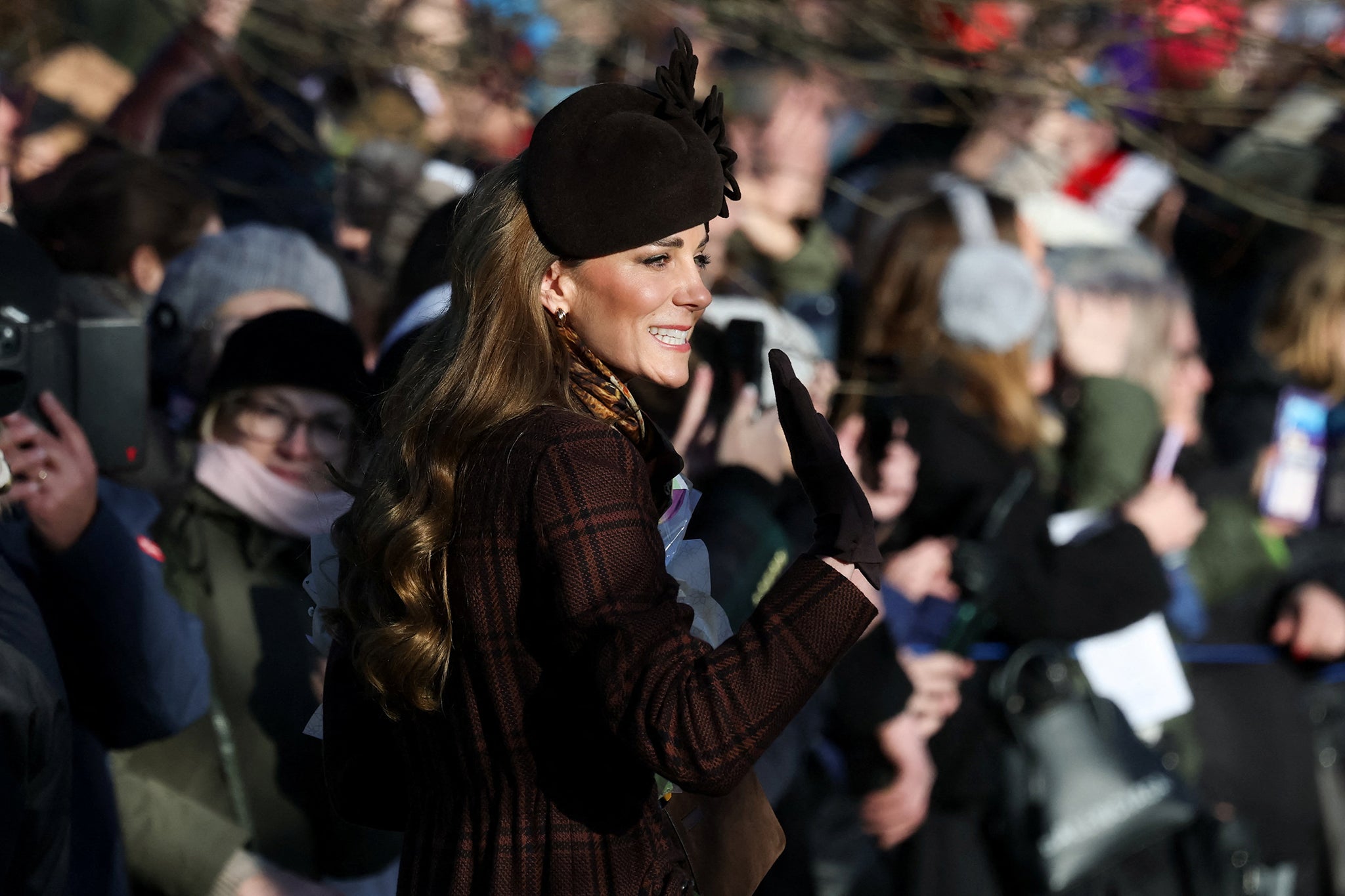 Princess of Wales waves to crowds as she leaves the church service
