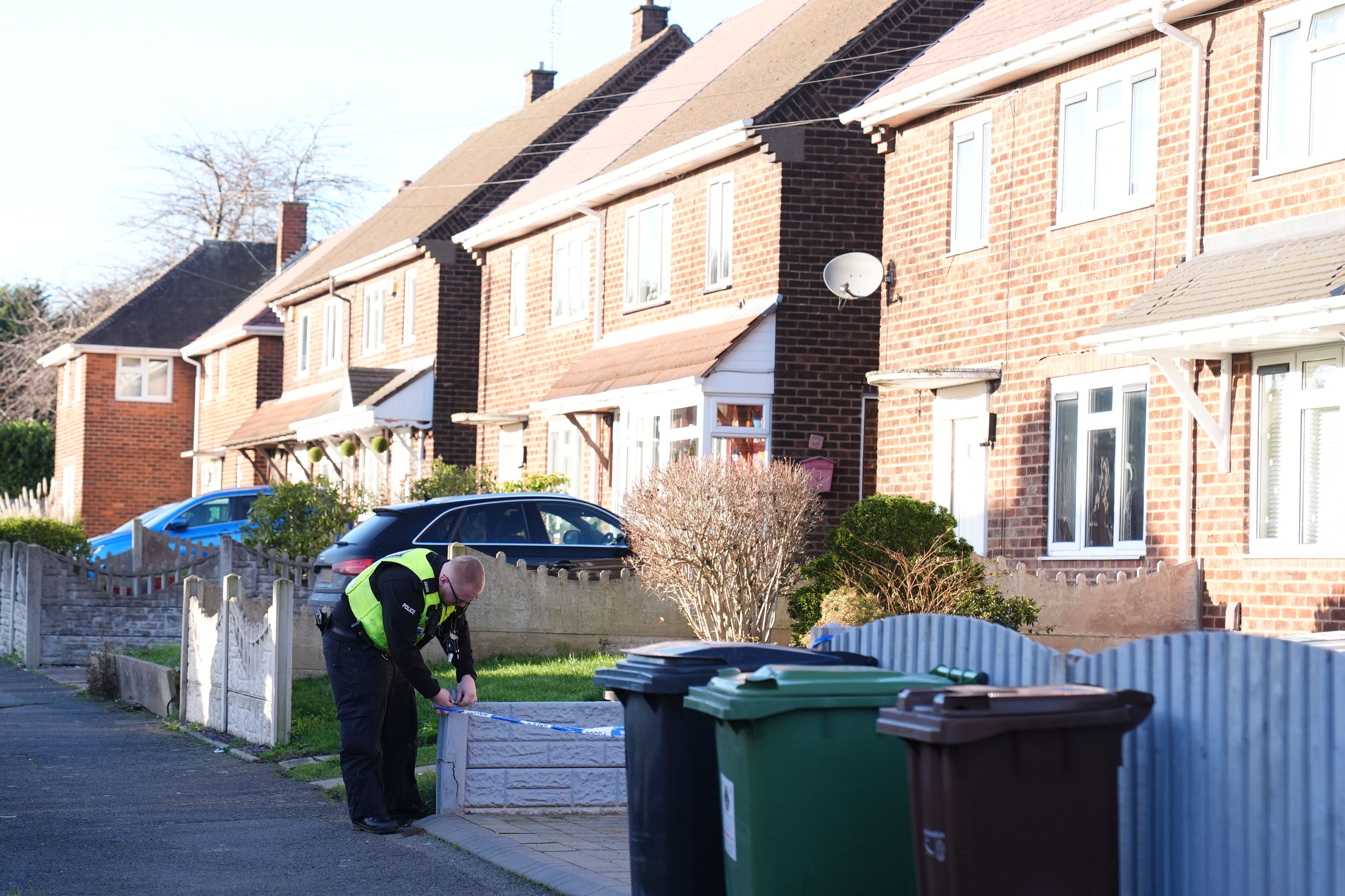 A police officer at the scene at Burcot Avenue in Wolverhampton (Jacob King/PA)