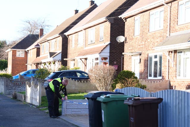 A police officer at the scene at Burcot Avenue in Wolverhampton (Jacob King/PA)
