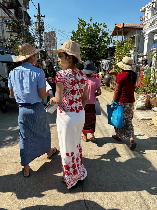 <p>Volunteers with the junta-backed USDP party out campaigning in Thaketa township, Yangon on Friday morning</p>