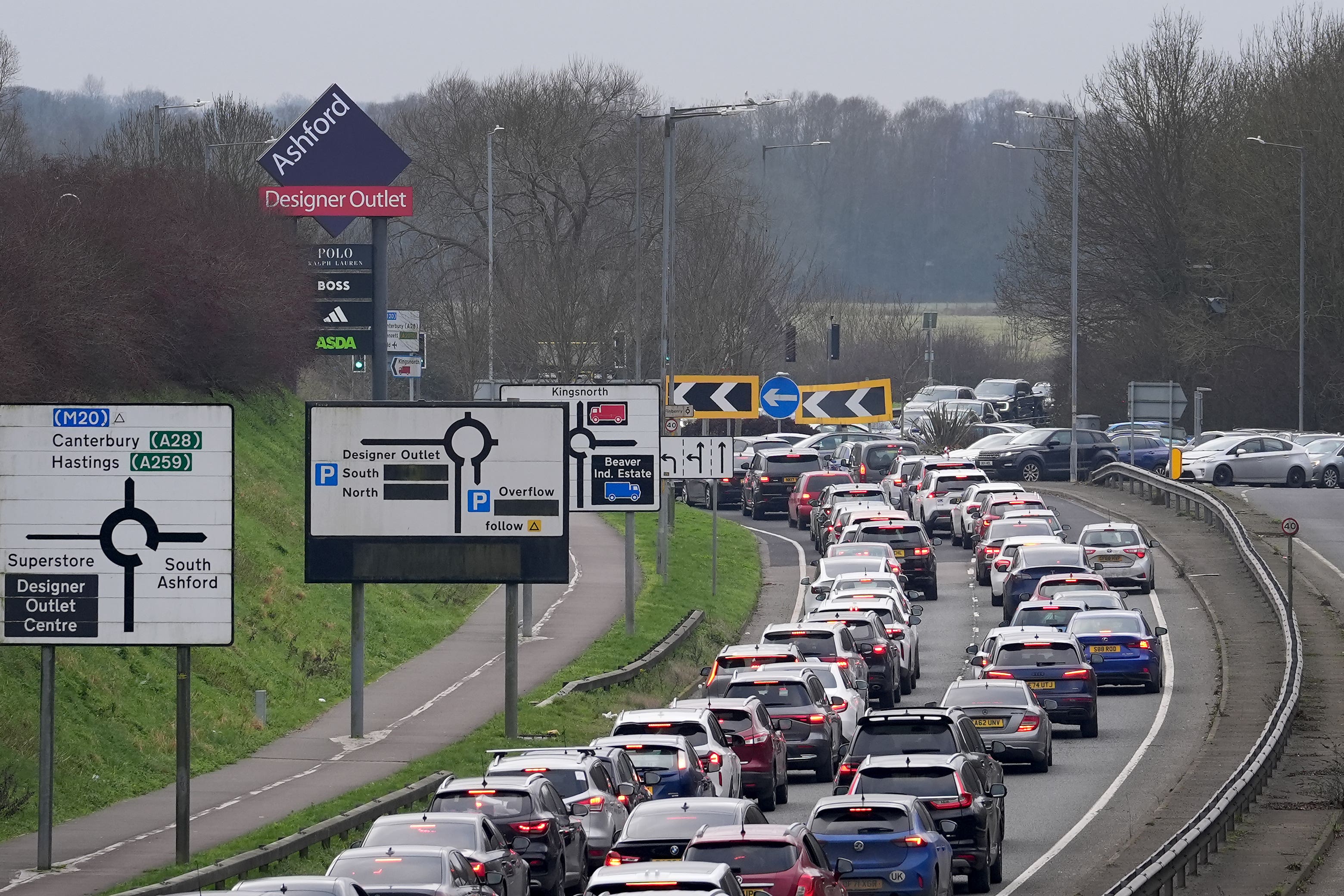 Vehicles queue for the car parks at the Ashford Designer Outlet (Gareth Fuller/PA)