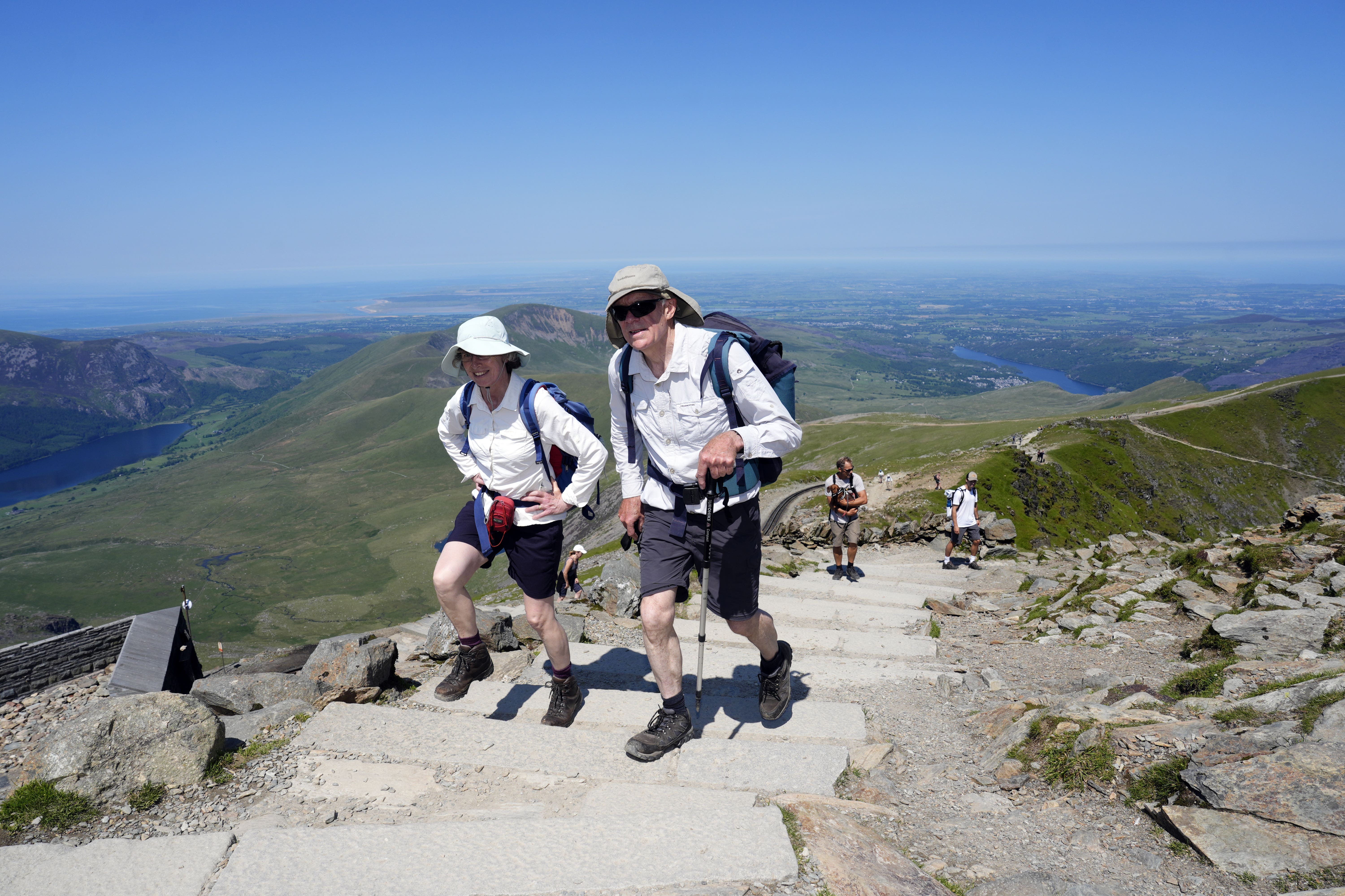 People walking at Yr Wyddfa in Snowdonia, Wales, on June 19, as parts of the UK basked in a heatwave (Nick Potts/PA)