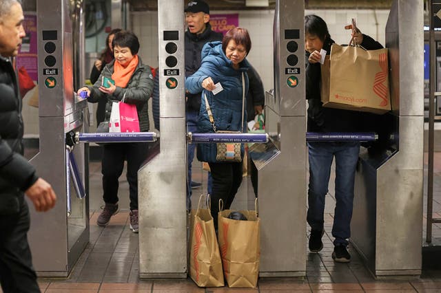 <p>Shoppers swipe their MetroCards as they enter the subway turnstiles, Nov. 29, 2024, in New York. (AP Photo/Heather Khalifa, File)</p>