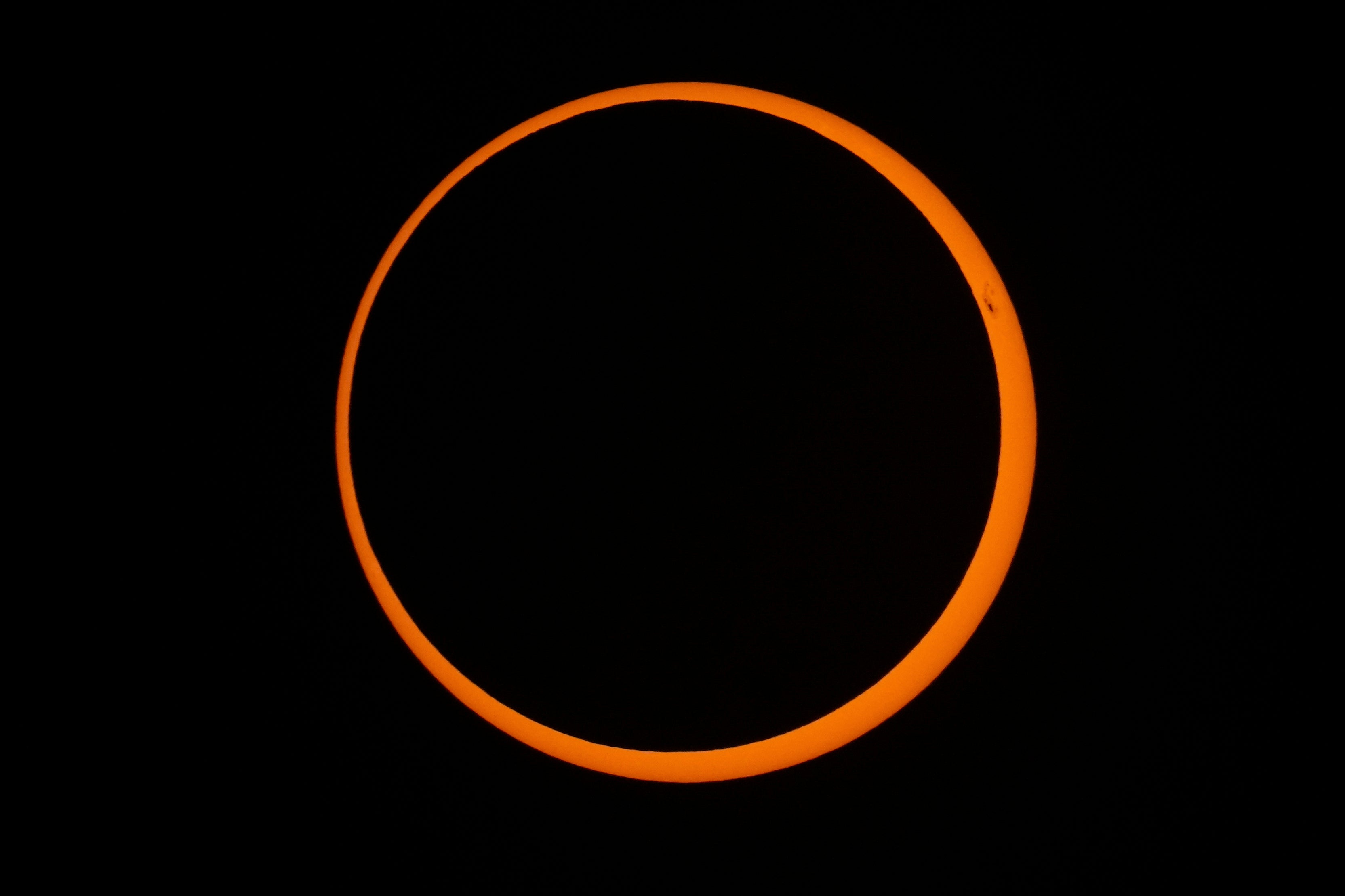 The moon moves across the sun during a "ring of fire" annular solar eclipse seen from Tahai, Rapa Nui (Easter Island), Chile, on Wednesday, Oct. 2, 2024. (AP Photo/Esteban Felix, File)