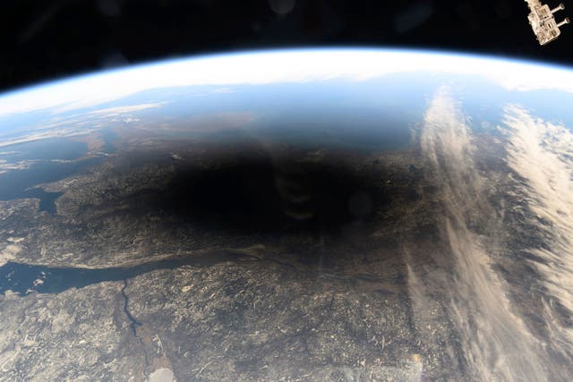 <p> This photo provided by NASA shows the Moon's shadow covering portions of Canada and the U.S. during a total solar eclipse as seen from the International Space Station on Monday, Aug. 8, 2024. (NASA via AP, File)</p>