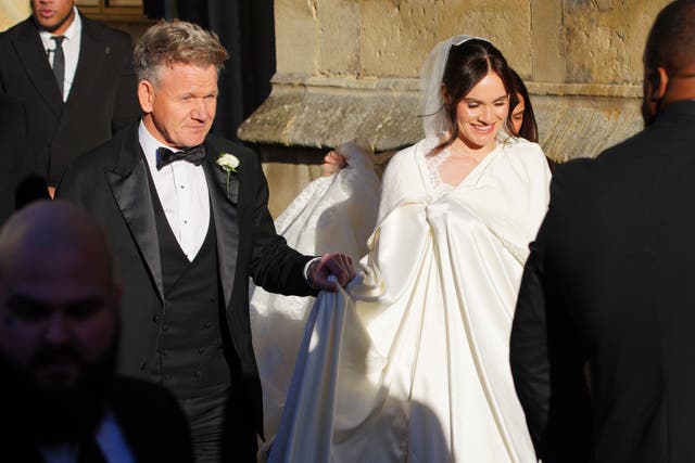<p>Celebrity chef Gordon Ramsay walked hand-in-hand with his 25-year-old daughter as they entered Bath Abbey for the ceremony (Ben Birchall/PA)</p>
