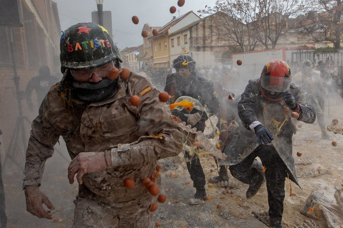 Photos show flour, eggs and firecrackers flying at Spains Els Enfarinats festival