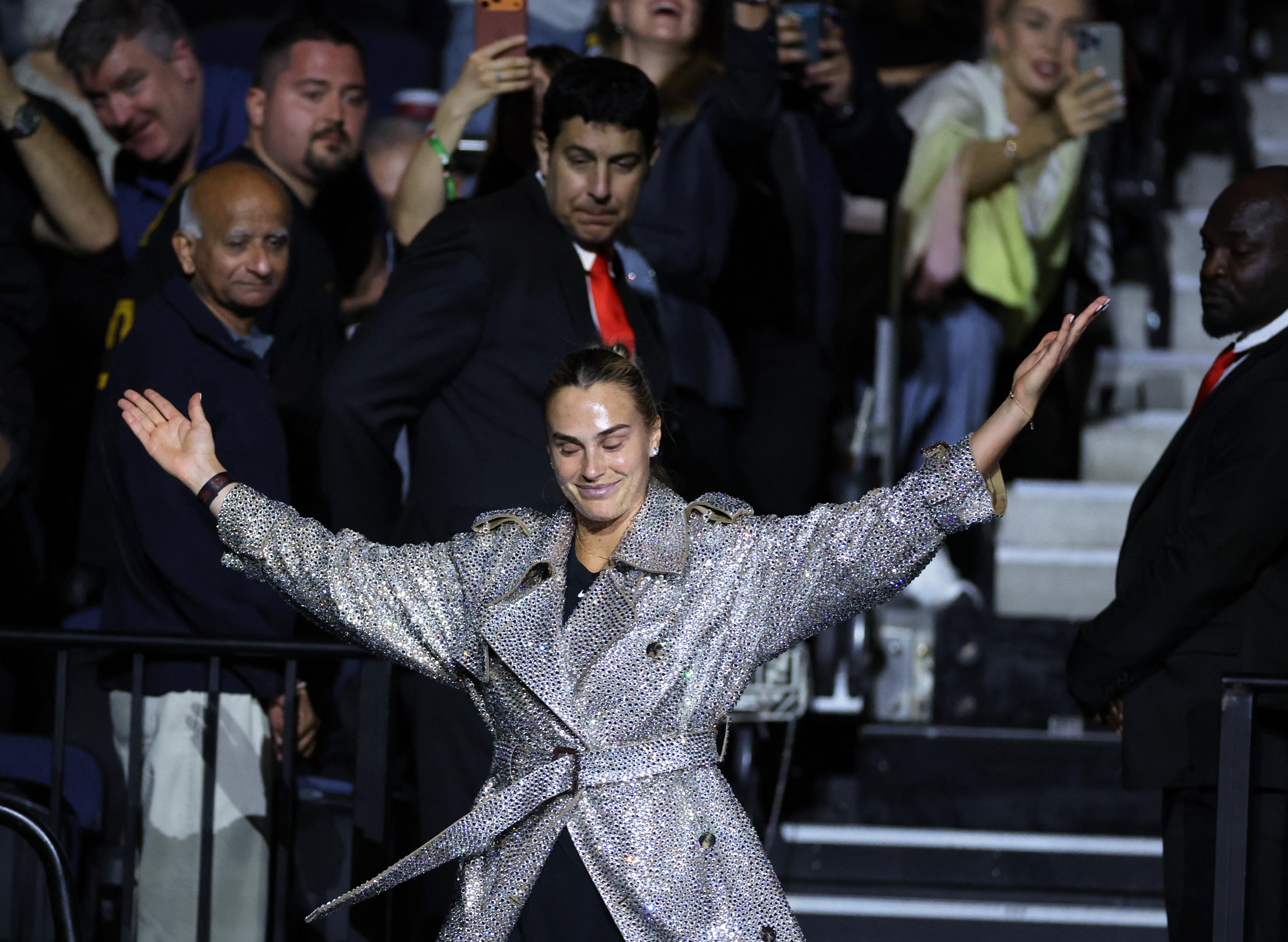 Sabalenka arrived onto the court in a glittering overcoat