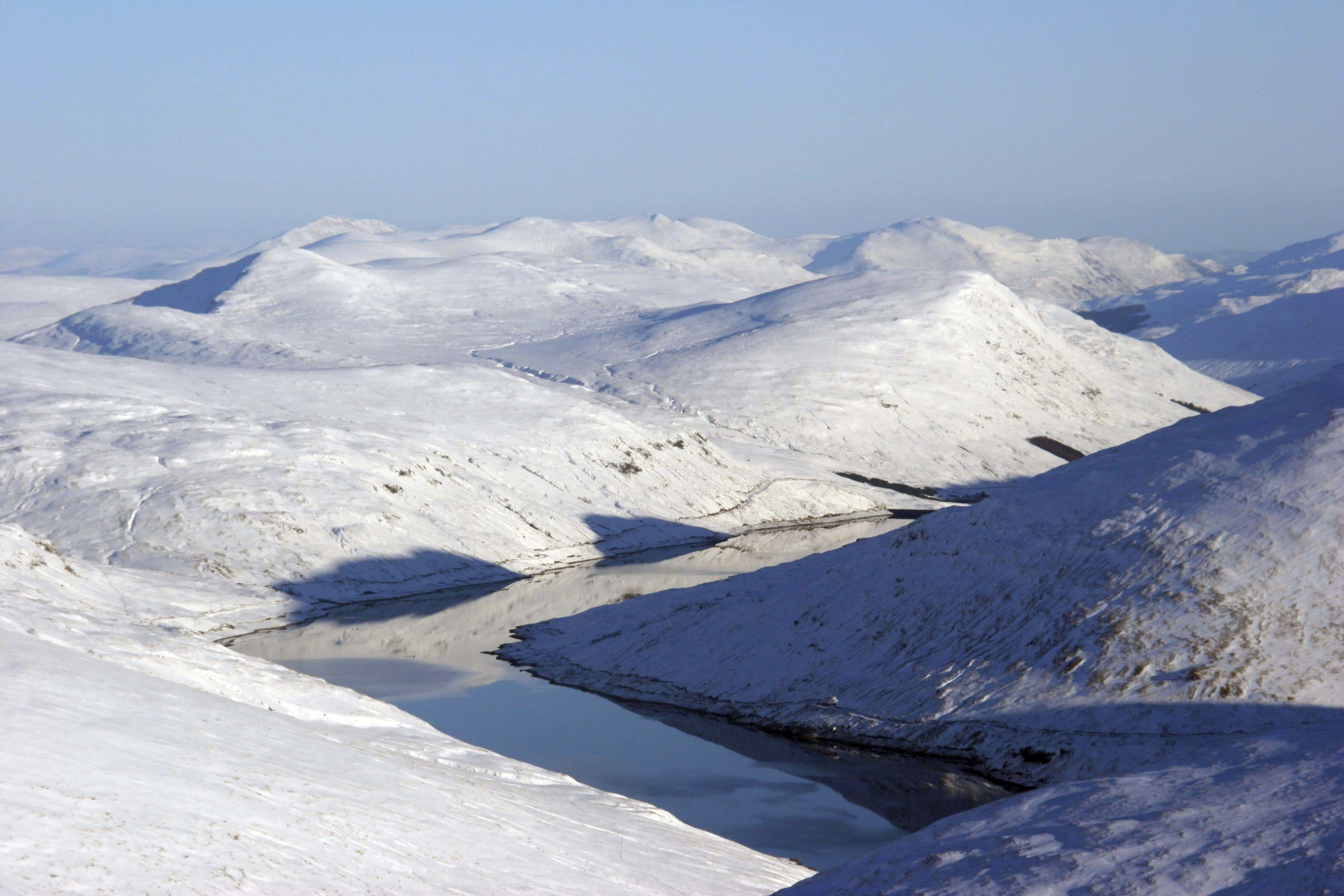 View of a loch surrounded by snow-covered mountains (file picture)