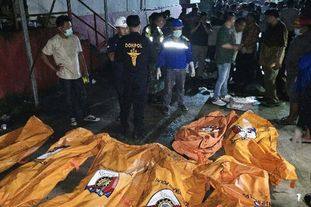 <p>Body bags containing victims of a fire at a retirement home in Manado, North Sulawesi province, Indonesia</p>