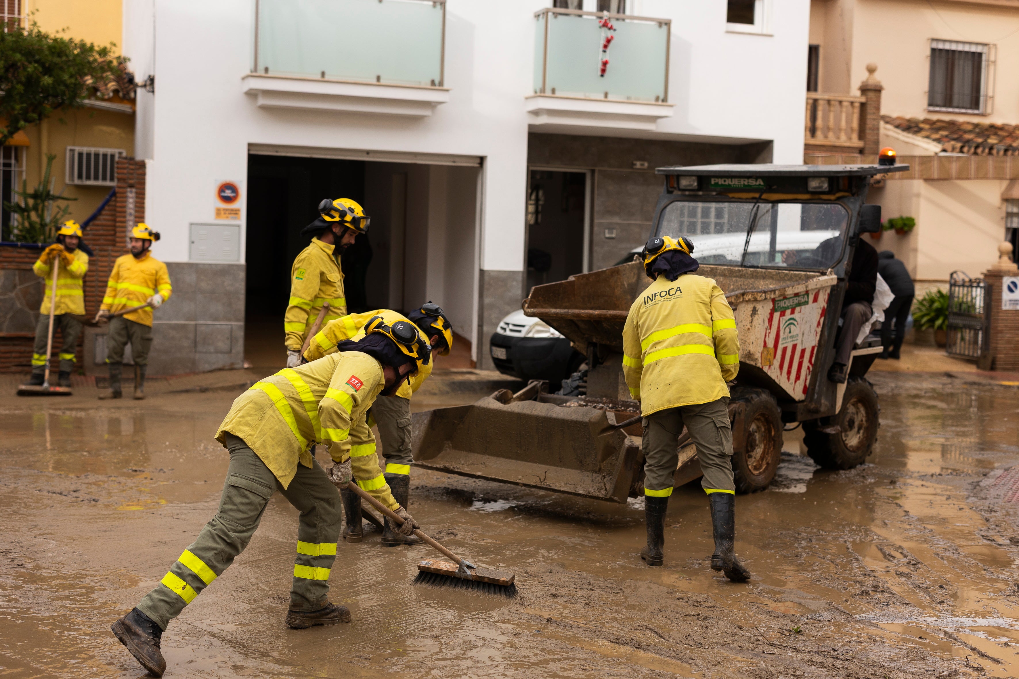 Authorities clean up floods in Estacion de Cartama, Malaga, on Sunday