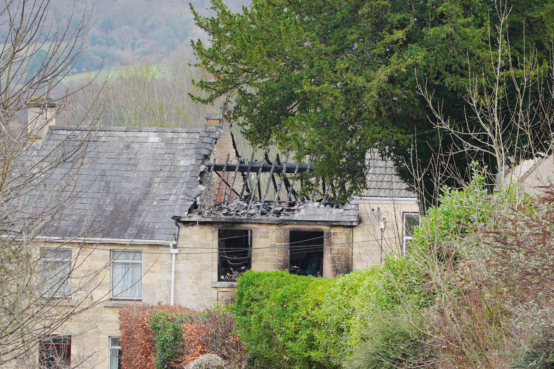 <p>Emergency services at the scene in Brimscombe Hill, near Stroud after a house fire</p>