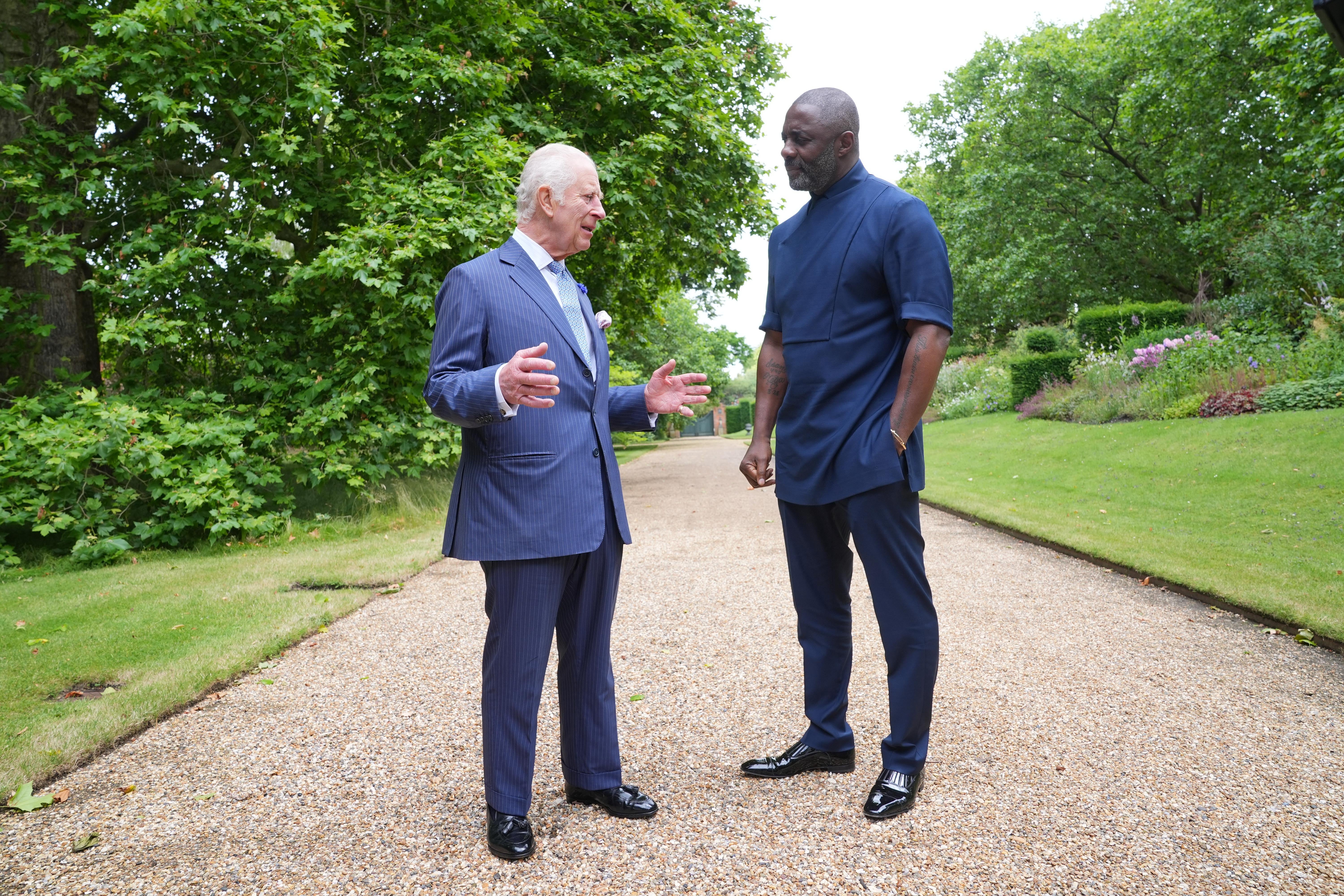 The King with Idris Elba at an event for The King’s Trust to discuss youth opportunity last year