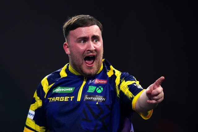 <p>England's Luke Littler reacts during his match against England's Rob Cross</p>