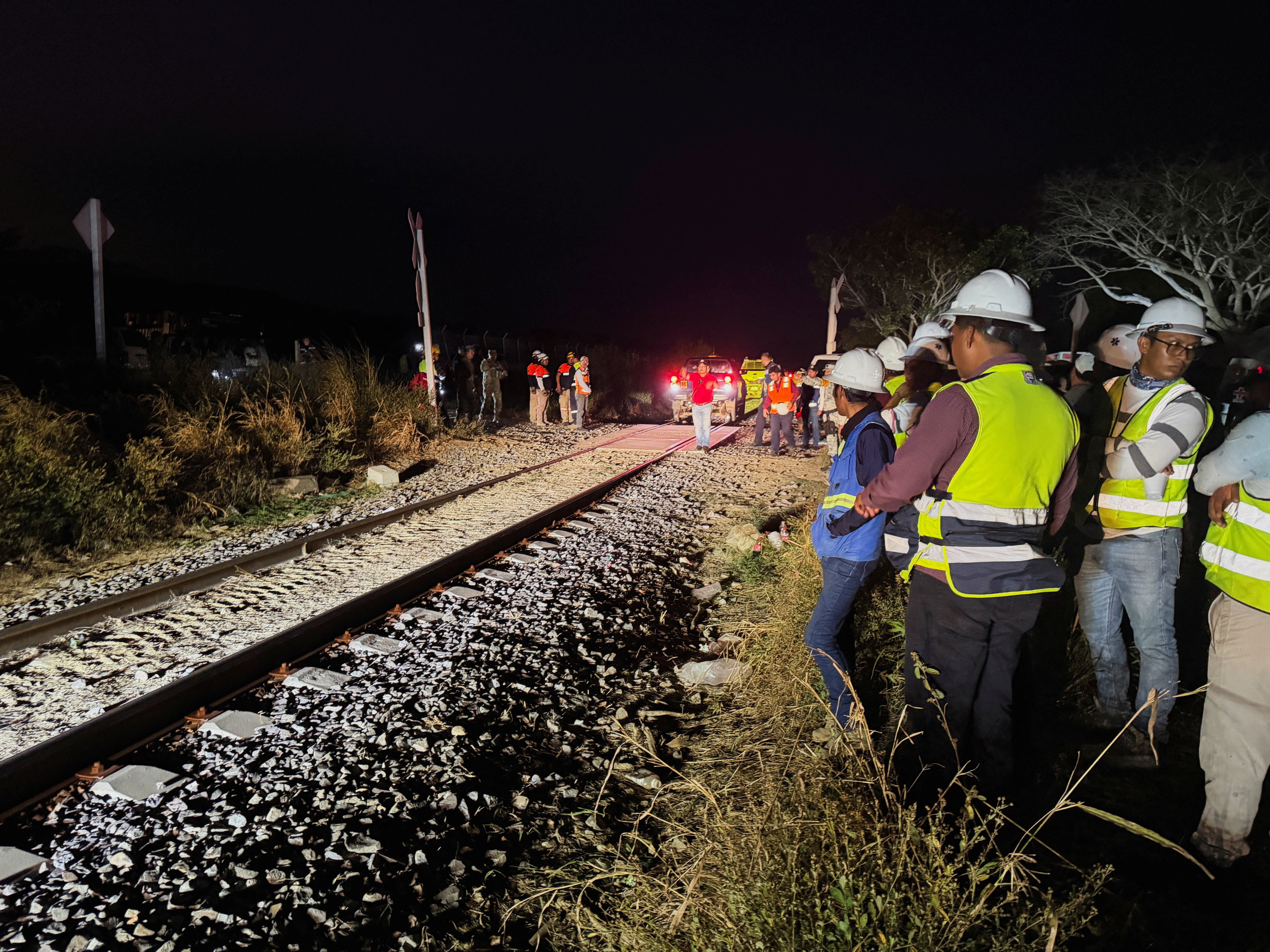 <p>Authorities work at the site of train derailment on the Interoceanic Corridor of the Isthmus of Tehuantepec, a railway line connecting Mexico's Pacific and Gulf coasts, where several passengers were killed and injured near Nizanda, Oaxaca state, Mexico, December, 28, 2025. REUTERS/Jose de Jesus Cortes</p>