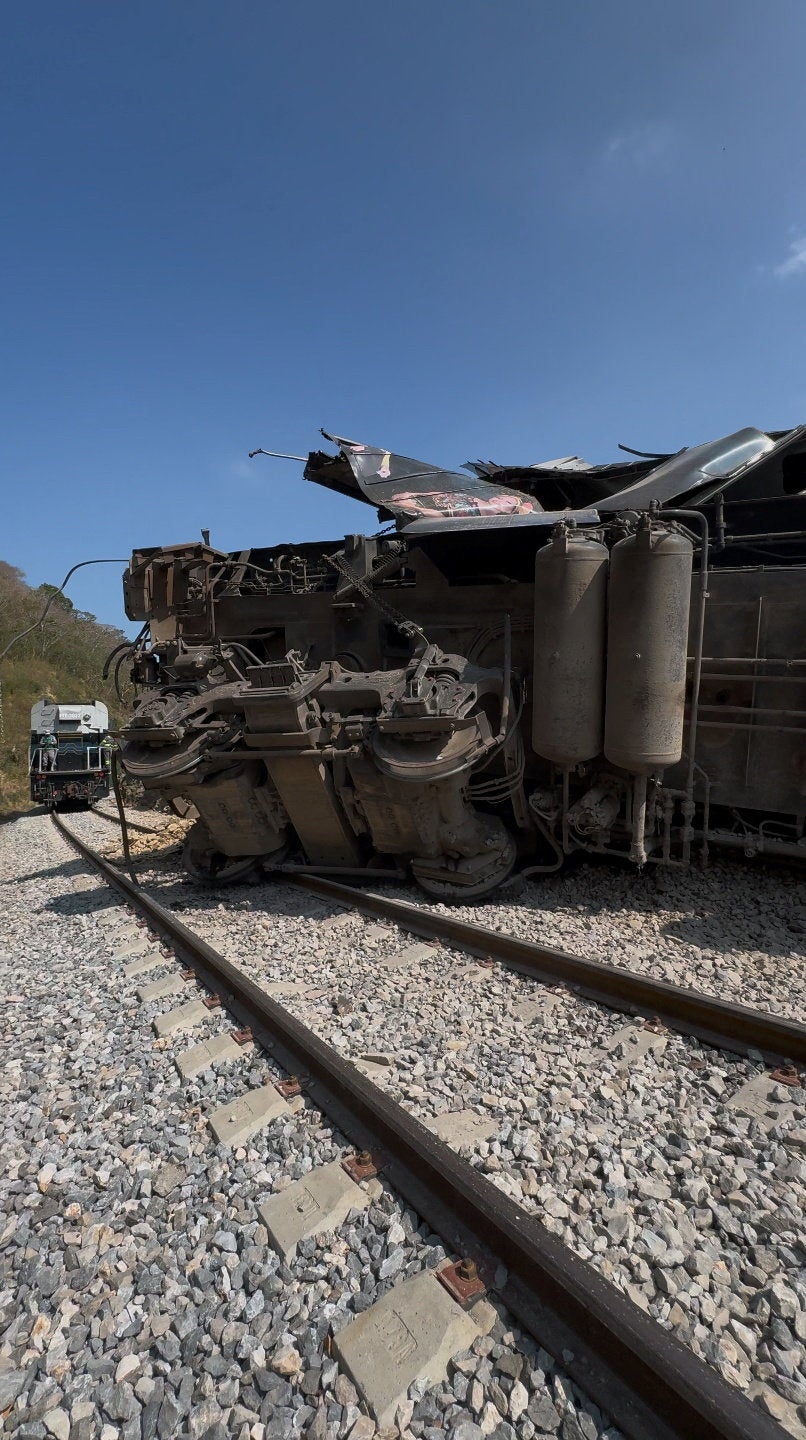 A compartment is overturned at the site of a train derailment on the Interoceanic Corridor of the Isthmus of Tehuantepec, a railway line connecting Mexico's Pacific and Gulf coasts, where several passengers were killed and injured near Nizanda, Oaxaca state, Mexico December 28, 2025 in this screen grab obtained from social media video. Video obtained by Reuters/via REUTERS THIS IMAGE HAS BEEN SUPPLIED BY A THIRD PARTY. NO RESALES. NO ARCHIVES.