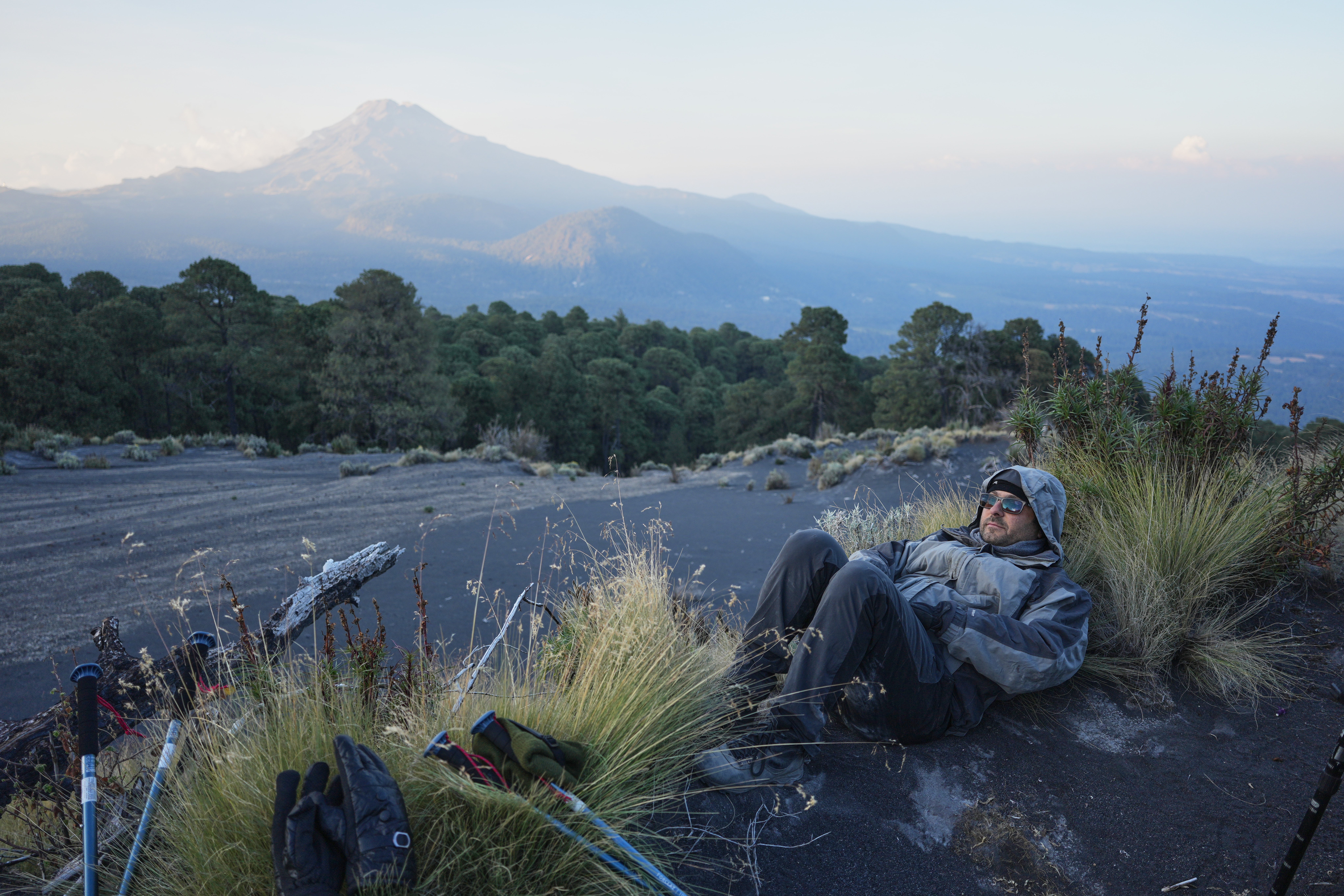 Marco Calo, a geophysicist at the National Autonomous University of Mexico (UNAM), rests near the campsite on the slopes of the Popocatepetl volcano, Mexico, Thursday, Dec. 4, 2025. (AP Photo/Eduardo Verdugo)