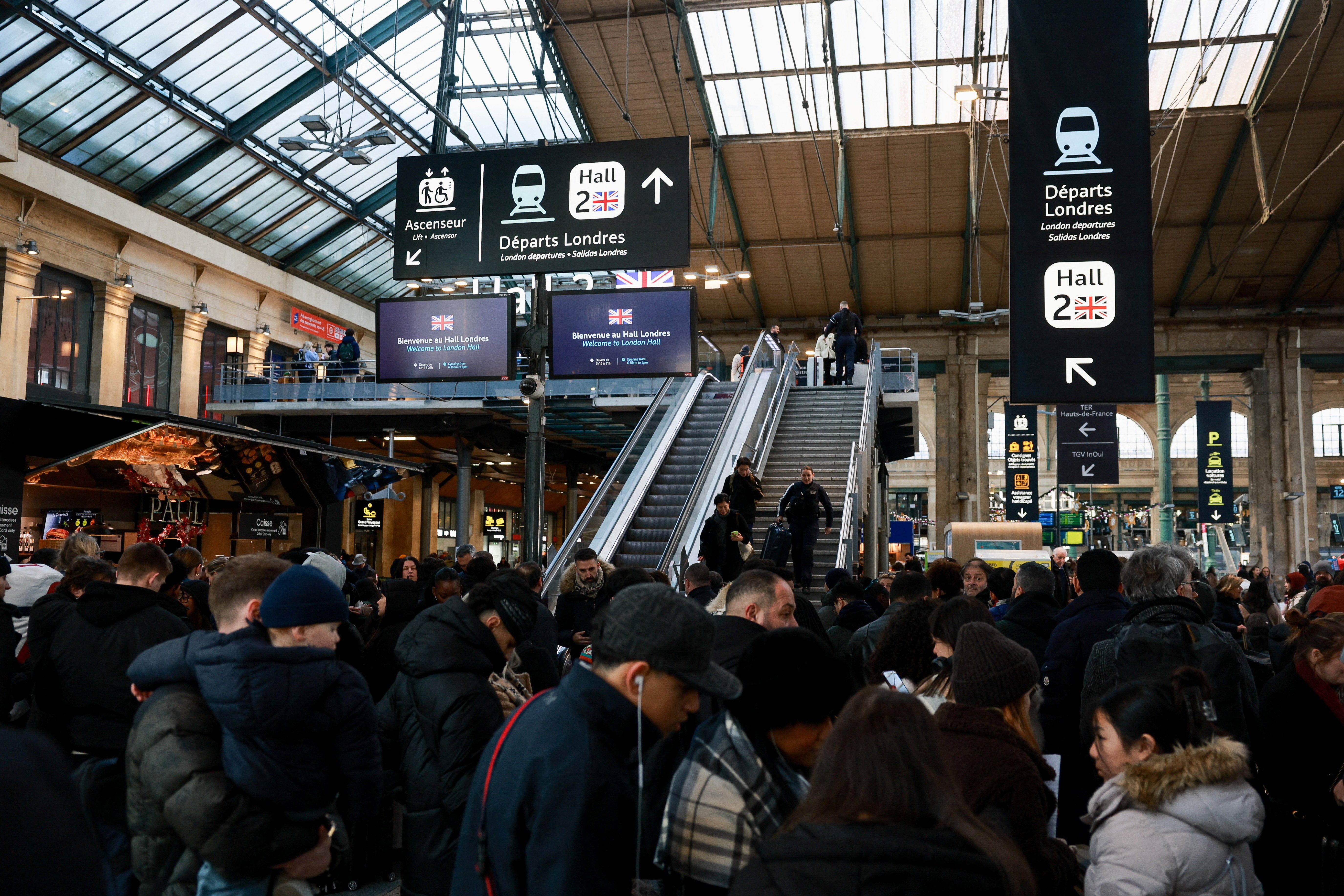 People gather at Gare du Nord station, after Eurostar announced a power supply problem in the Channel Tunnel