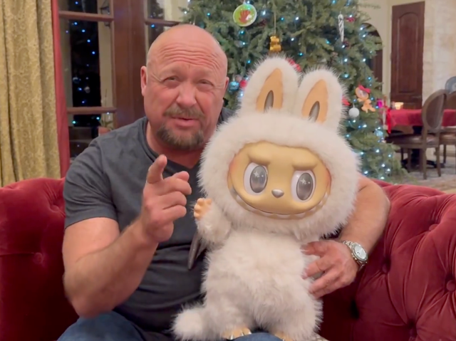 <p>Alex Jones poses with a Labubu in a Christmas video for his followers on X, rather than address the Epstein files</p>