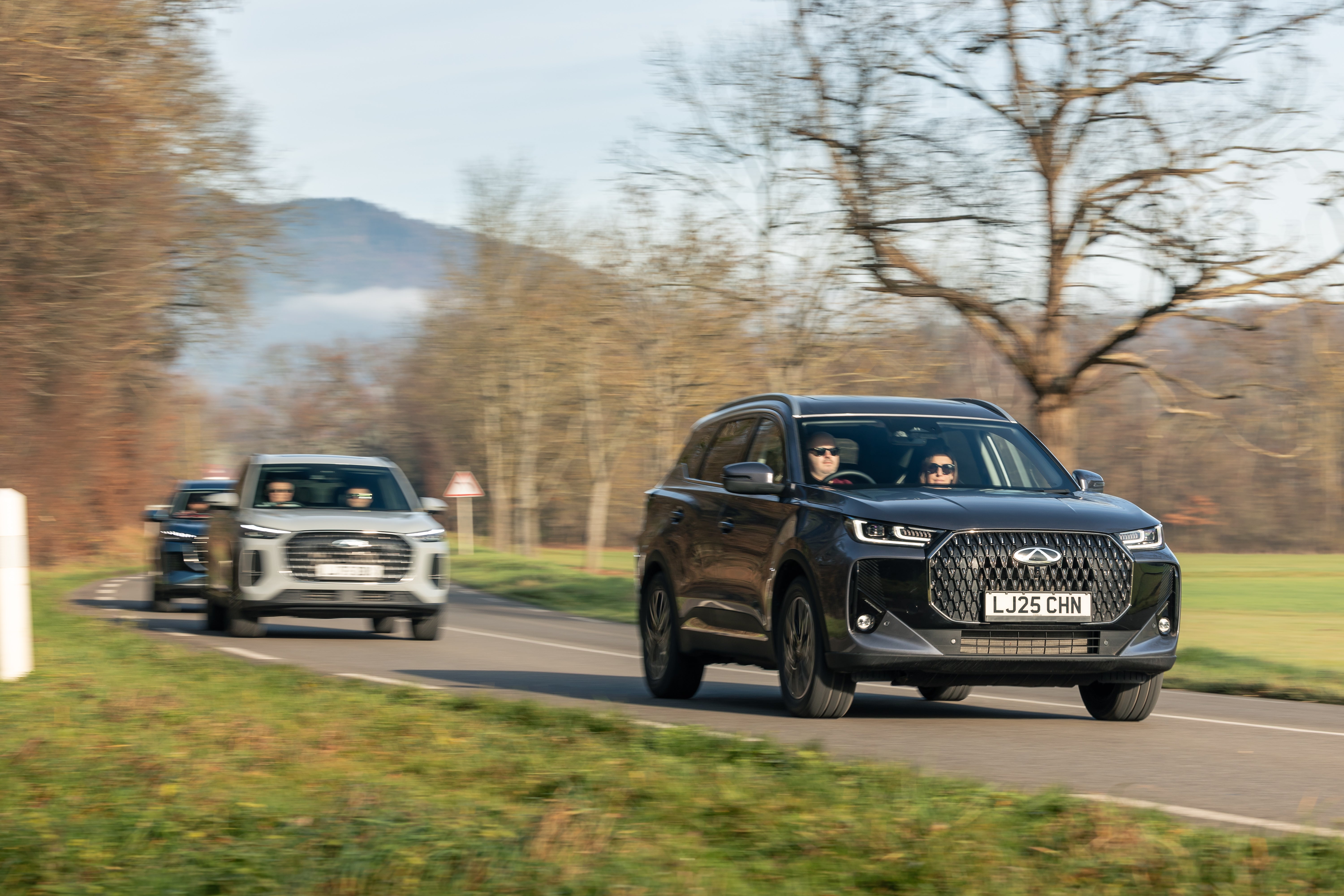 Three Chery Tiggo PHEVs that each managed a 650-mile-plus trip on one tank of fuel and one battery charge