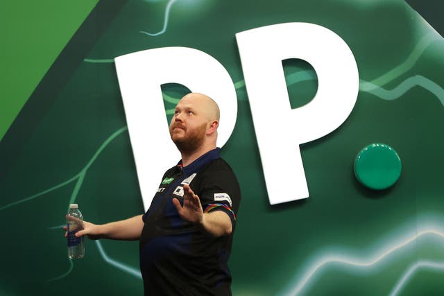 <p>Justin Wood claimed a stunning win over Josh Rock at the PDC World Darts Championship </p>