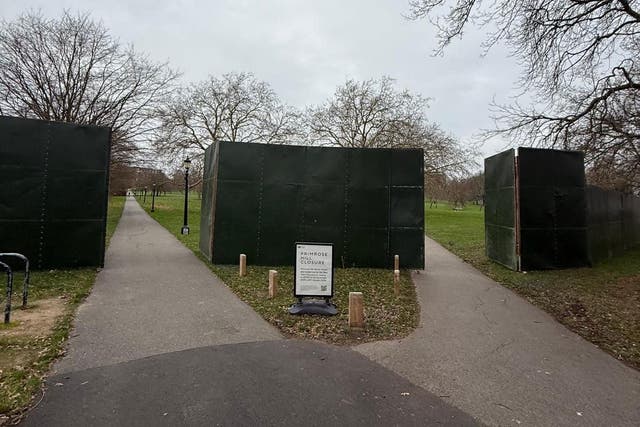 <p>Some of the dark green hoarding put up around Primrose Hill in Camden</p>