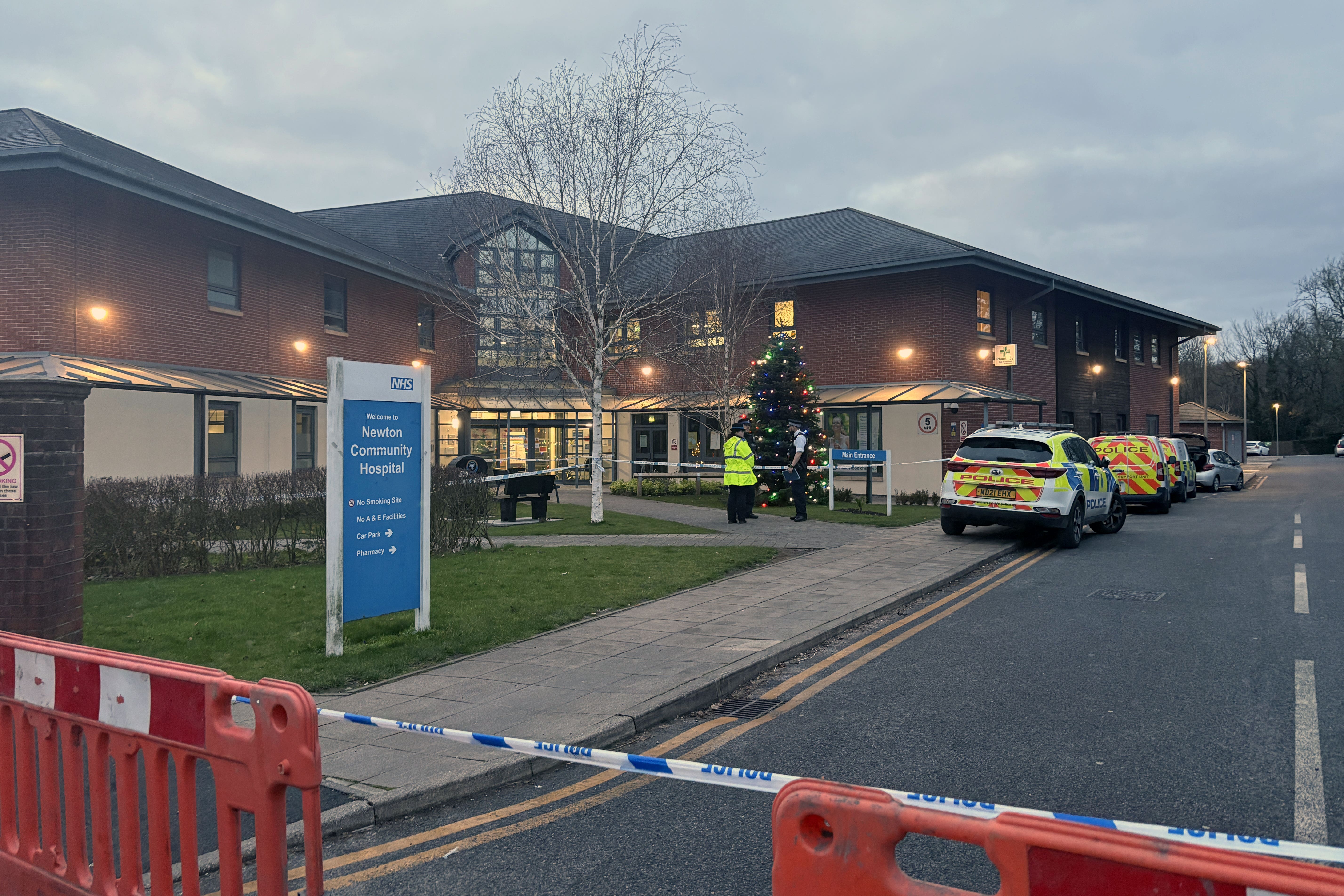 Police outside Newton Community Hospital in Merseyside, a man allegedly attacked hospital staff with a weapon which police say may have been a crowbar after he was denied an appointment (Eleanor Barlow/PA)