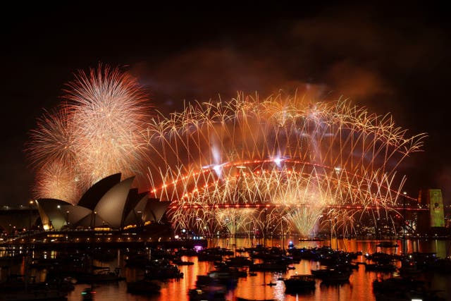 <p>Fireworks explode over Sydney Harbour Bridge to mark the New Year in Sydney, Australia, January 1, 2026. REUTERS/Hollie Adams</p>
