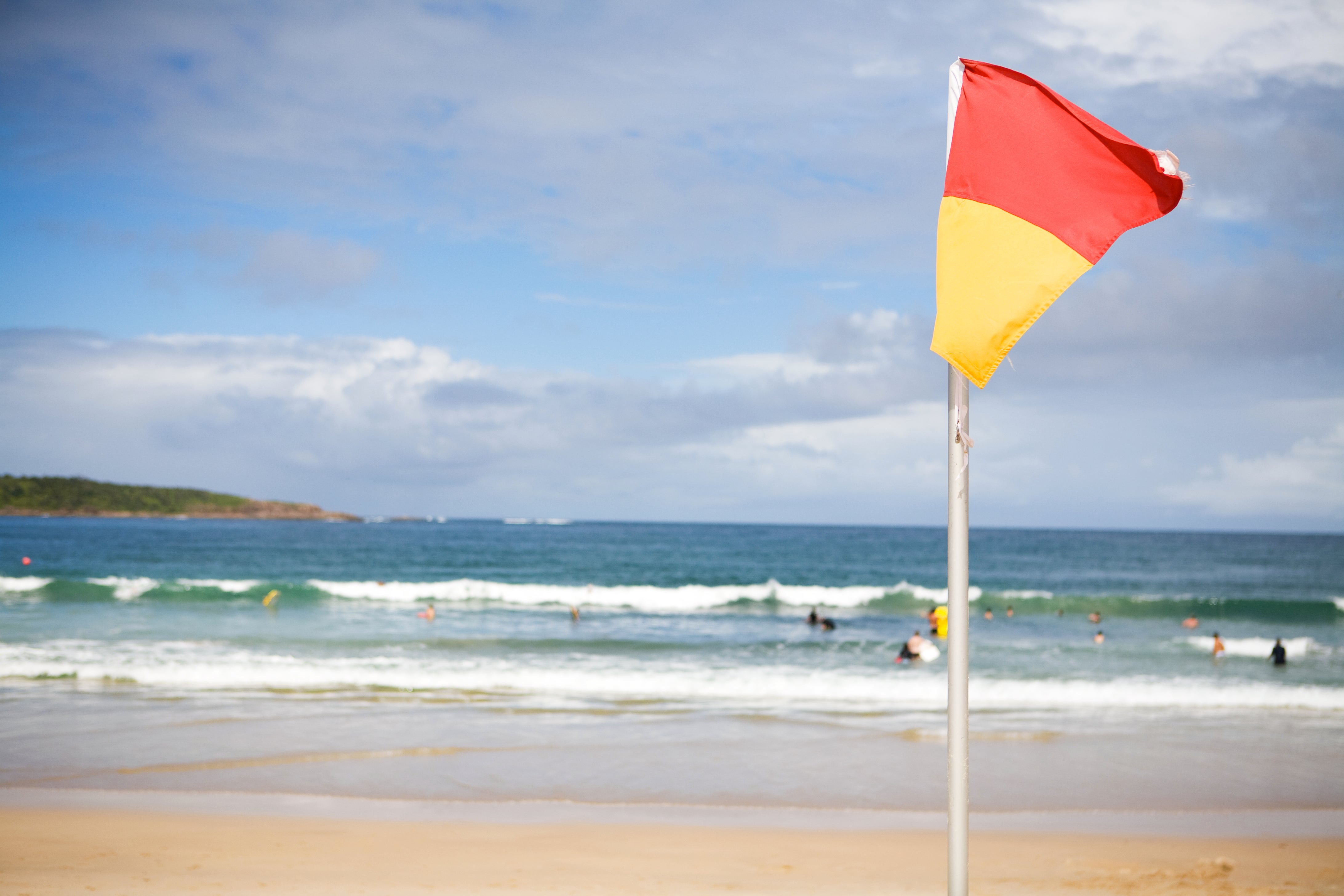<p>A recent study developed and examined a modified version of the red and yellow beach safety flag</p>