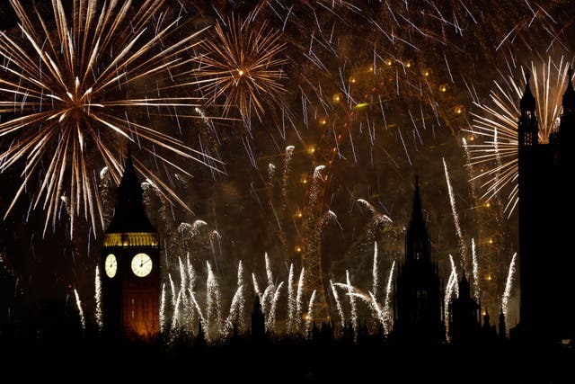 <p>Fireworks explode in the sky to bring in the New Year around the London Eye and the Elizabeth Tower</p>