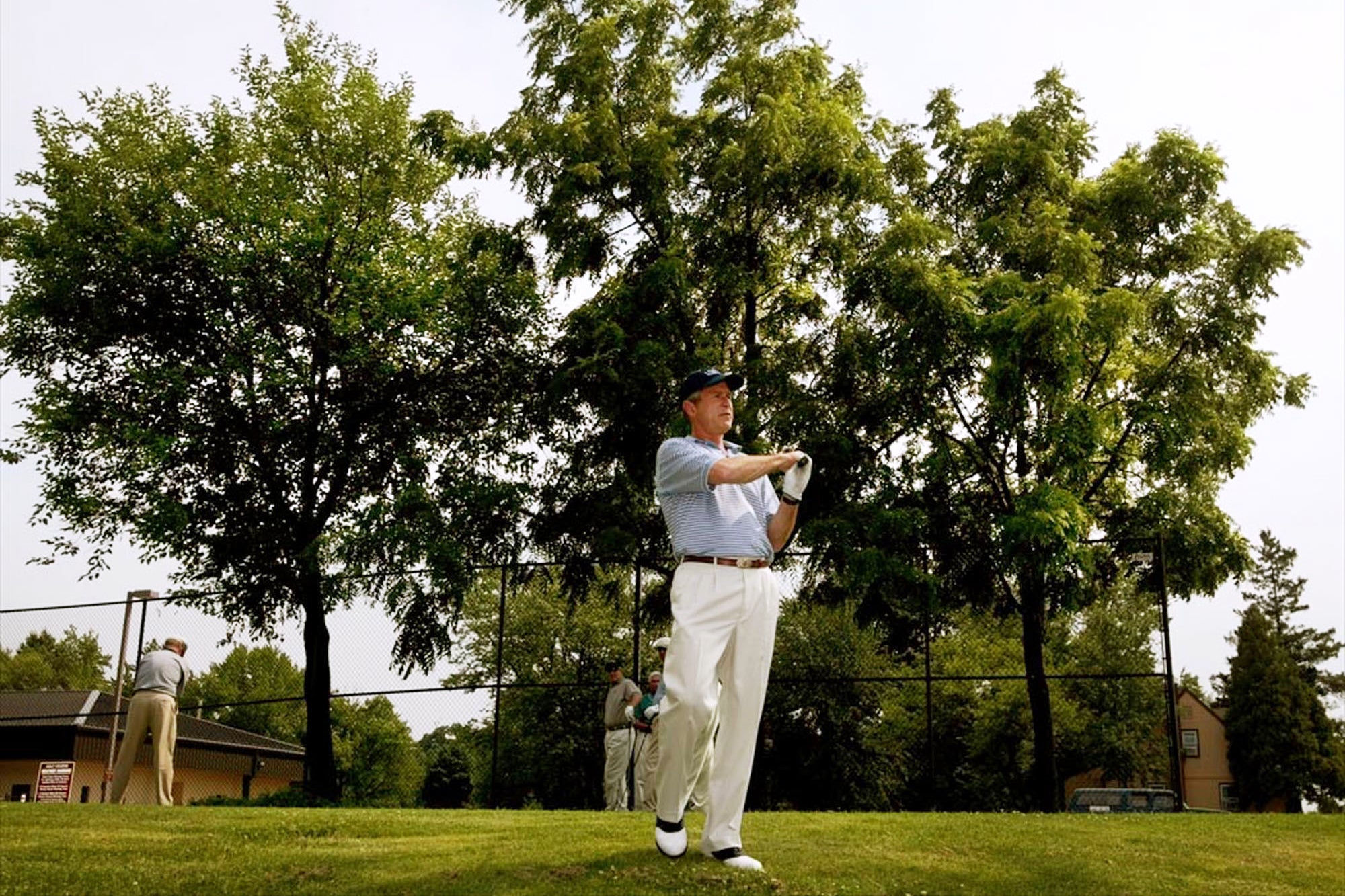 <p>President George W. Bush practices his swing as he prepares to tee off on the first hole at the golf course at Andrews Air Force Base, Md., July 3, 2002. (AP Photo/Pablo Martinez Monsivais, File)</p>