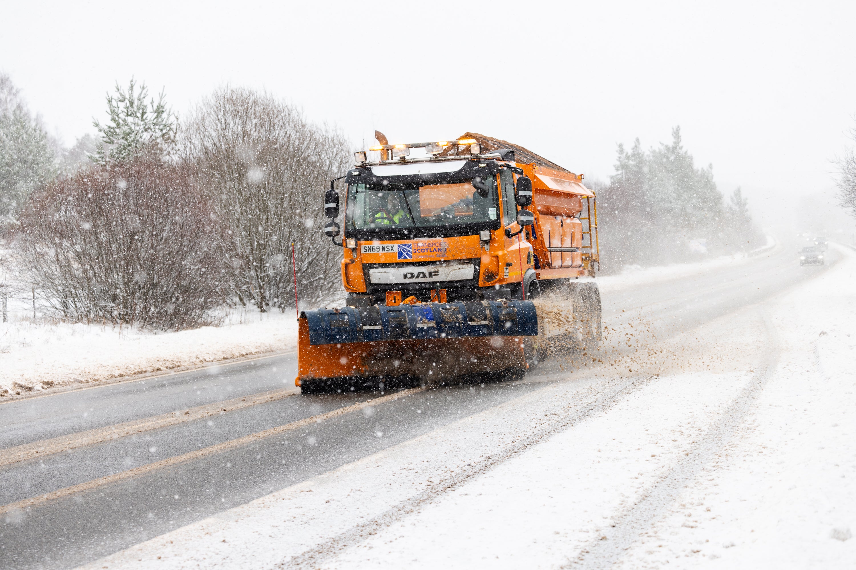 Gritter lorry on A9, south of Inverness. Amber weather warnings have been expanded after coming into force in parts of Scotland (Paul Campbell/PA Wire)