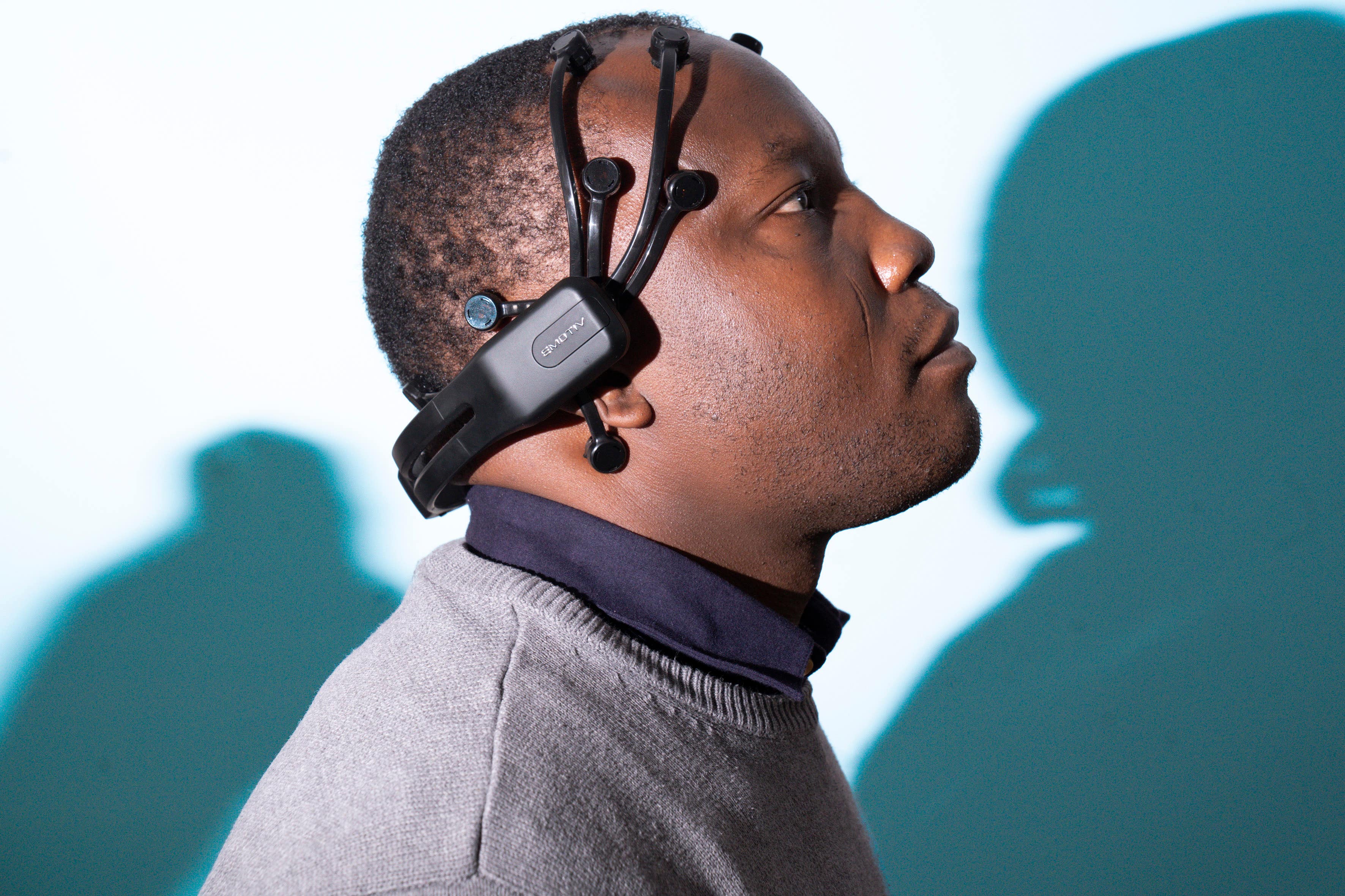 Peter Akor with a prototype of the AI Epilepsy headset (Glasgow Caledonian University/Mark Gibson/PA)
