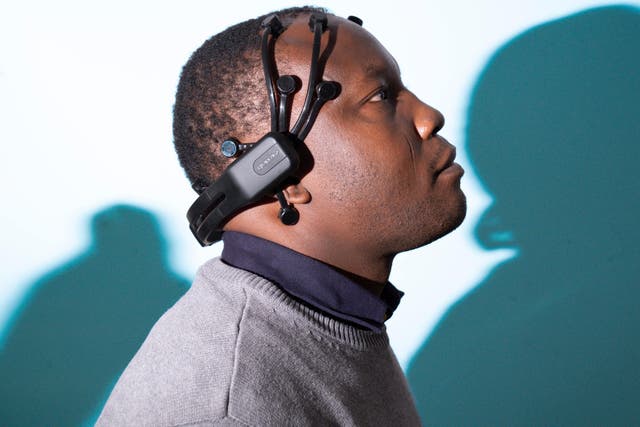 Peter Akor with a prototype of the AI Epilepsy headset (Glasgow Caledonian University/Mark Gibson/PA)