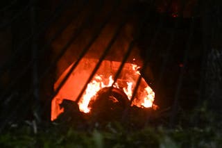 A vehicle burns at La Carlota air base in Caracas