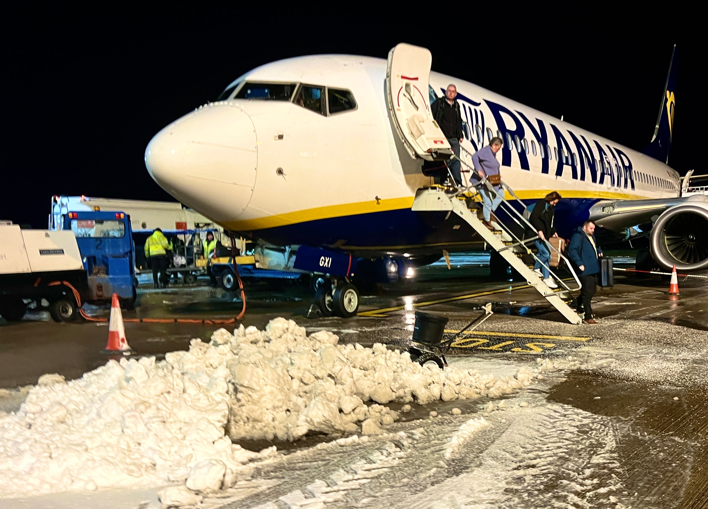 <p>Freeze frame: Ryanair passengers from Alicante arriving at a snow-covered Norwich airport</p>