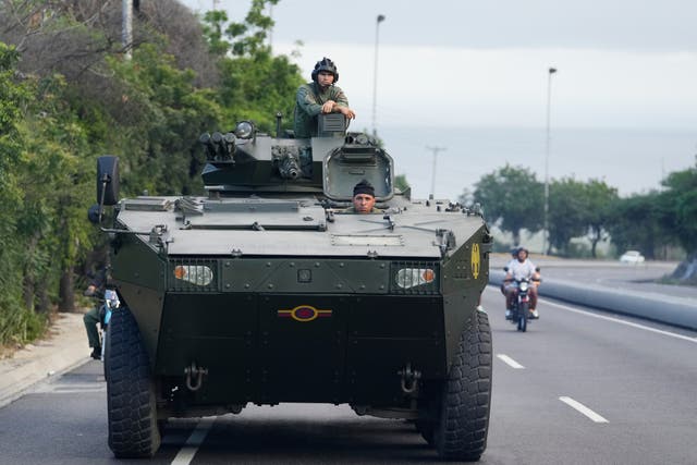 <p>A soldier stands atop an armored vehicle on the highway leading from the international airport toward Caracas, Venezuela, Sunday, Jan. 4, 2026. (AP Photo/Matias Delacroix)</p>