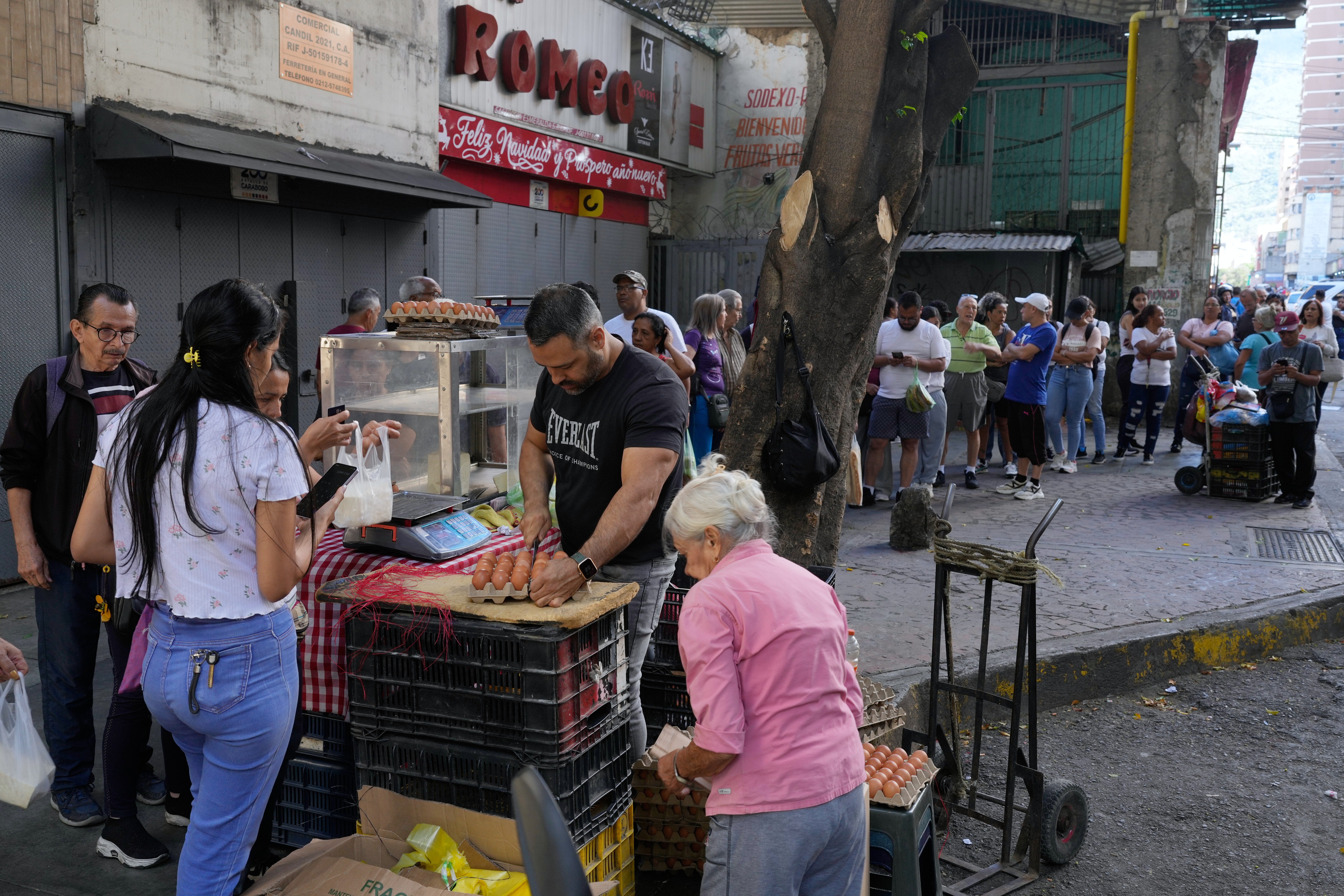 Shoppers line up to buy eggs in Caracas, Venezuela on Sunday