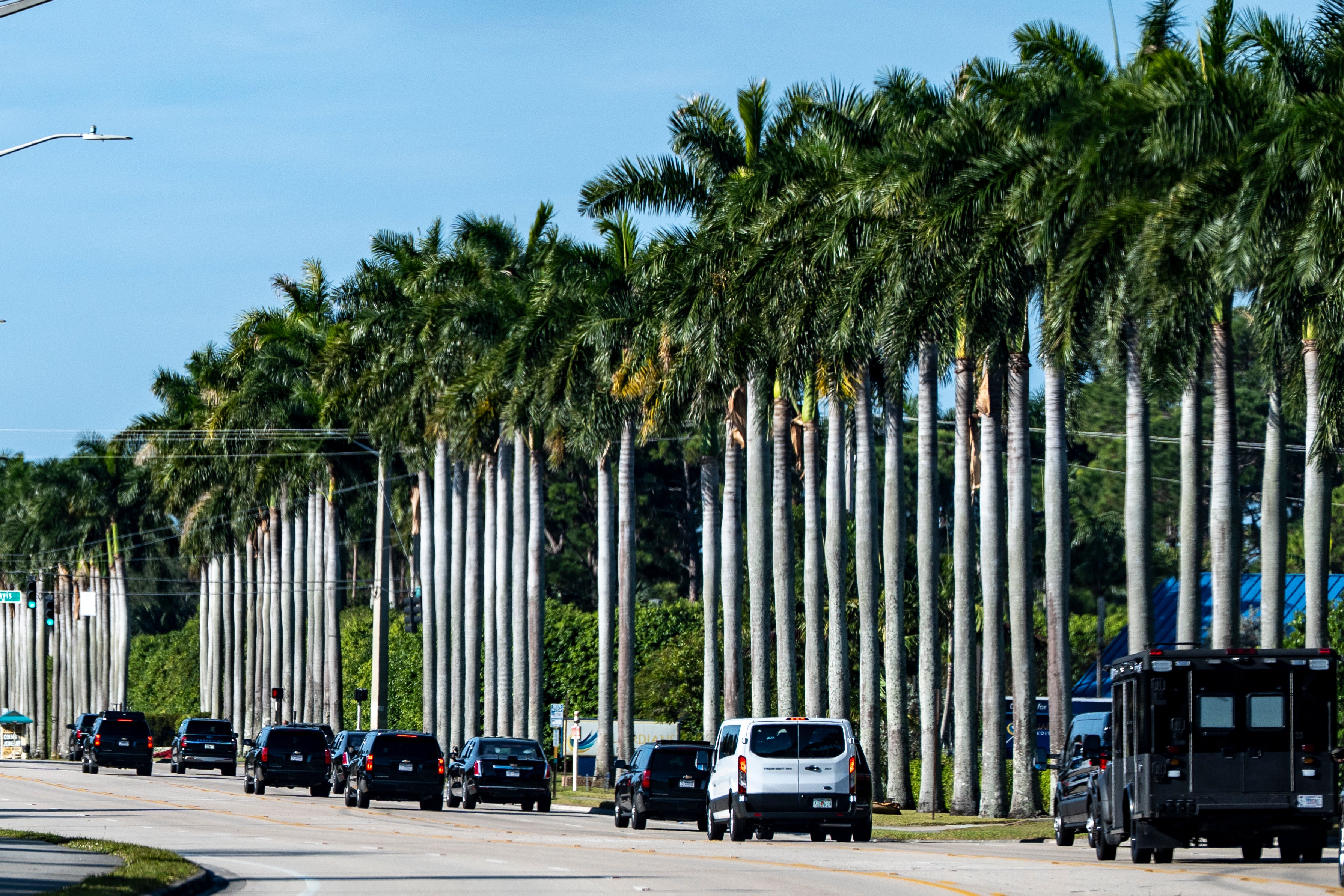 The motorcade for President Donald Trump rolls to Trump International Golf Club in West Palm Beach, Florida