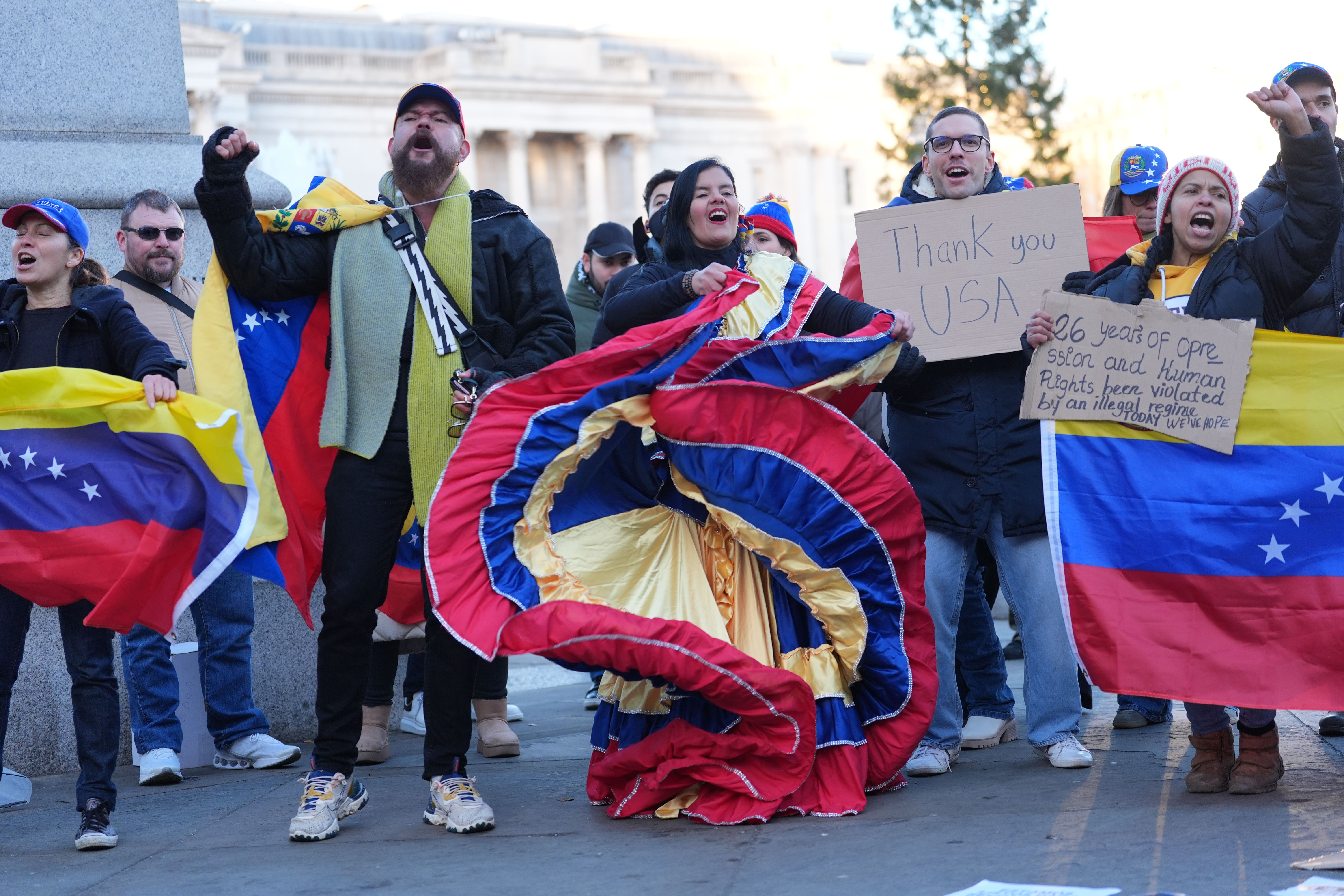 Members of the Venezuelan community in the UK, celebrate in Trafalgar Square following the US attack on Venezuela and the capture and detention of its President Nicolas Maduro (Yui Mok/PA)