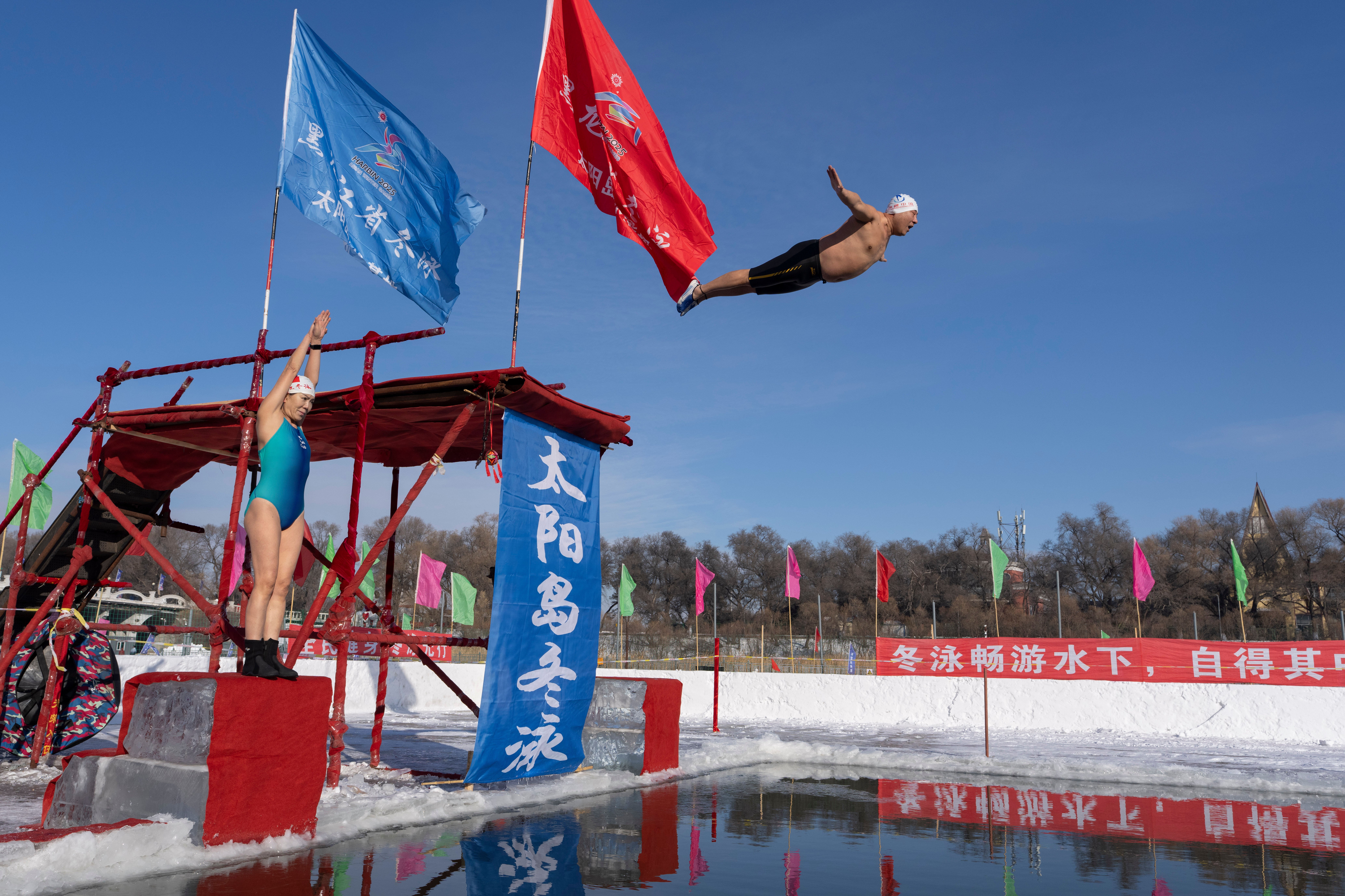 Brave souls dive into the icy waters in Harbin