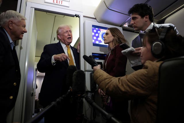 <p>President Trump speaks with reporters on Air Force One</p>