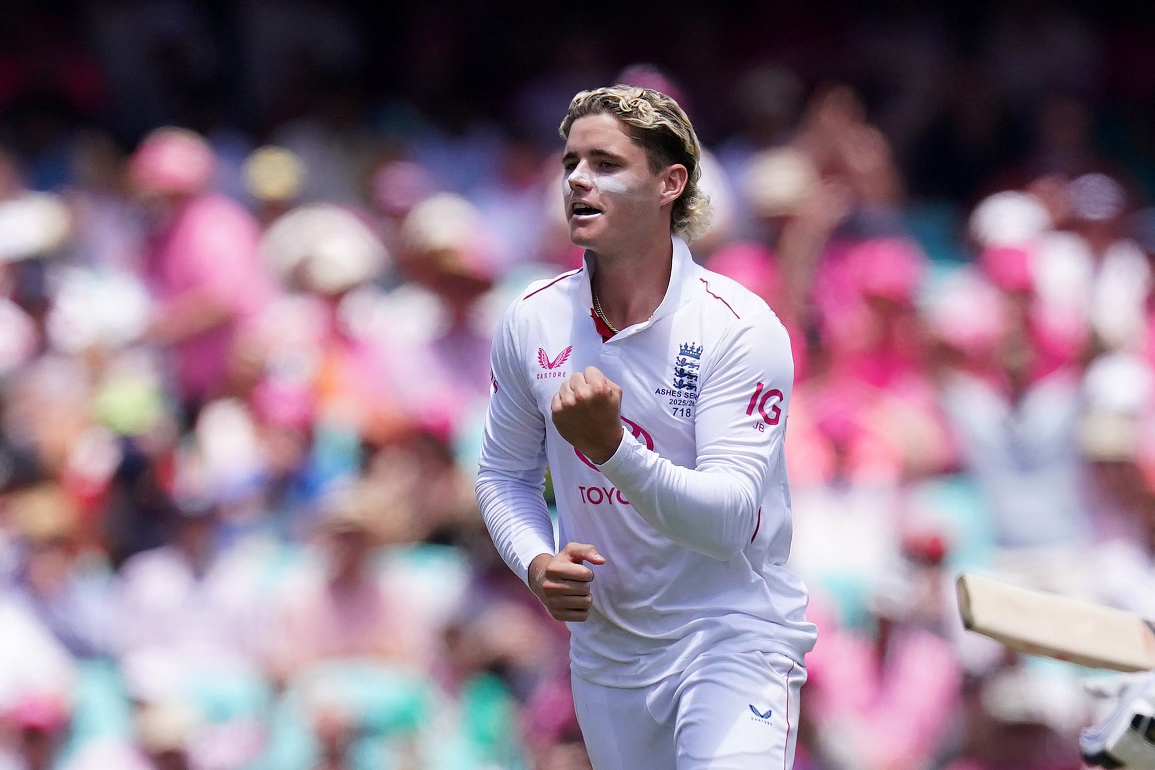 England’s Jacob Bethell celebrates taking the wicket of Australia’s Travis Head at the SCG on Tuesday (Robbie Stephenson/PA)