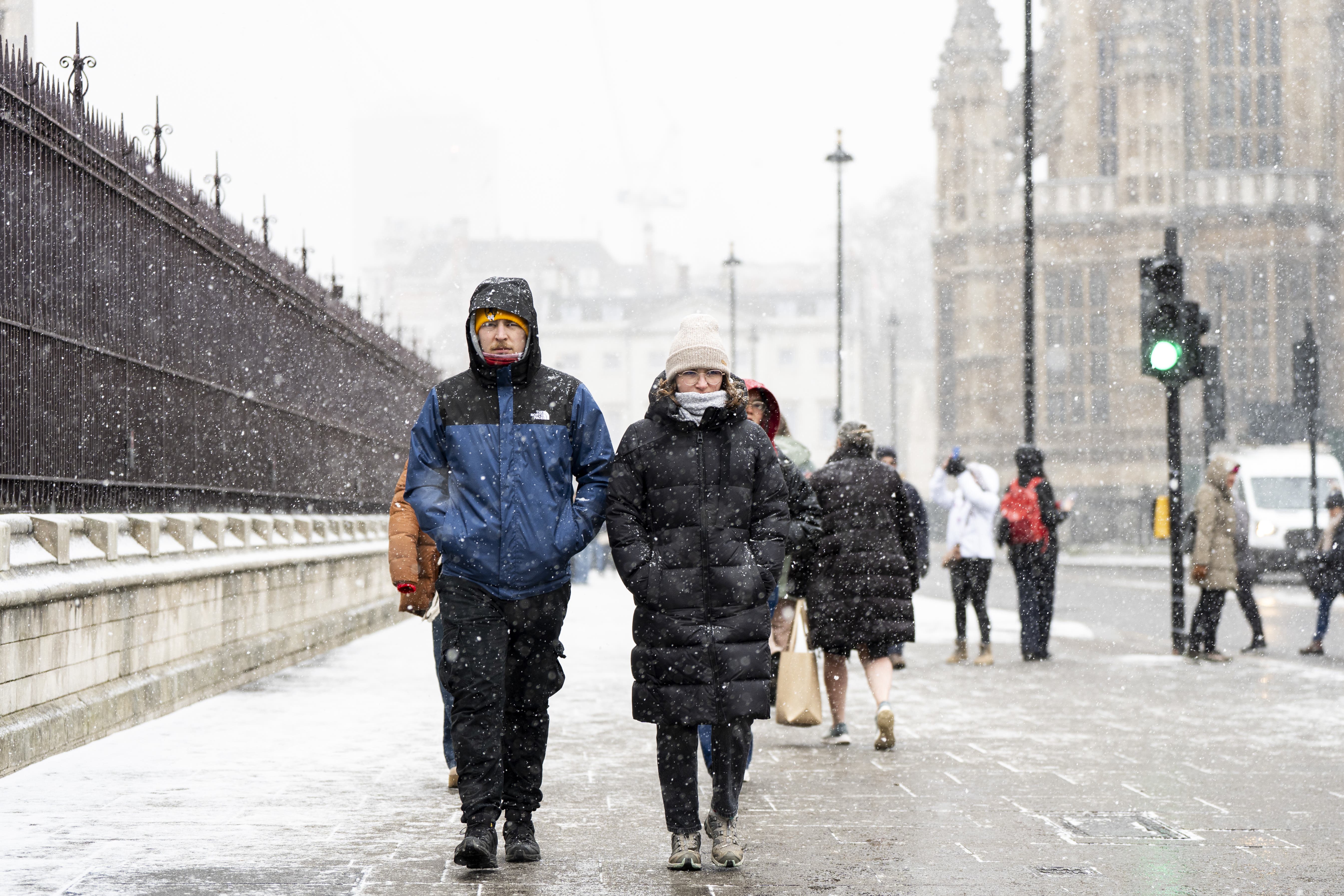 People in the snowy conditions in Westminster on Tuesday